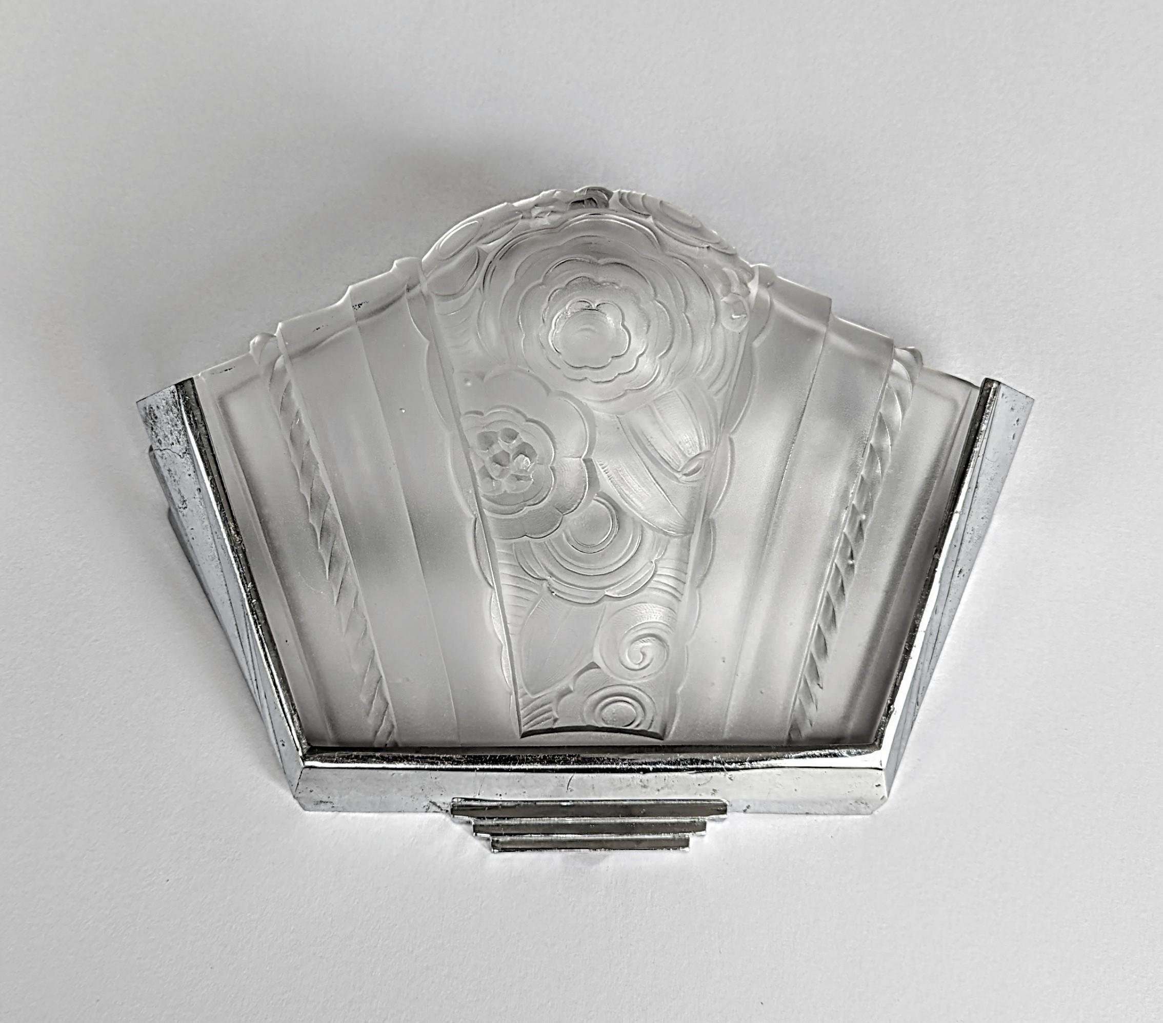 A stunning pair of French Art Deco wall sconces by the French artist 