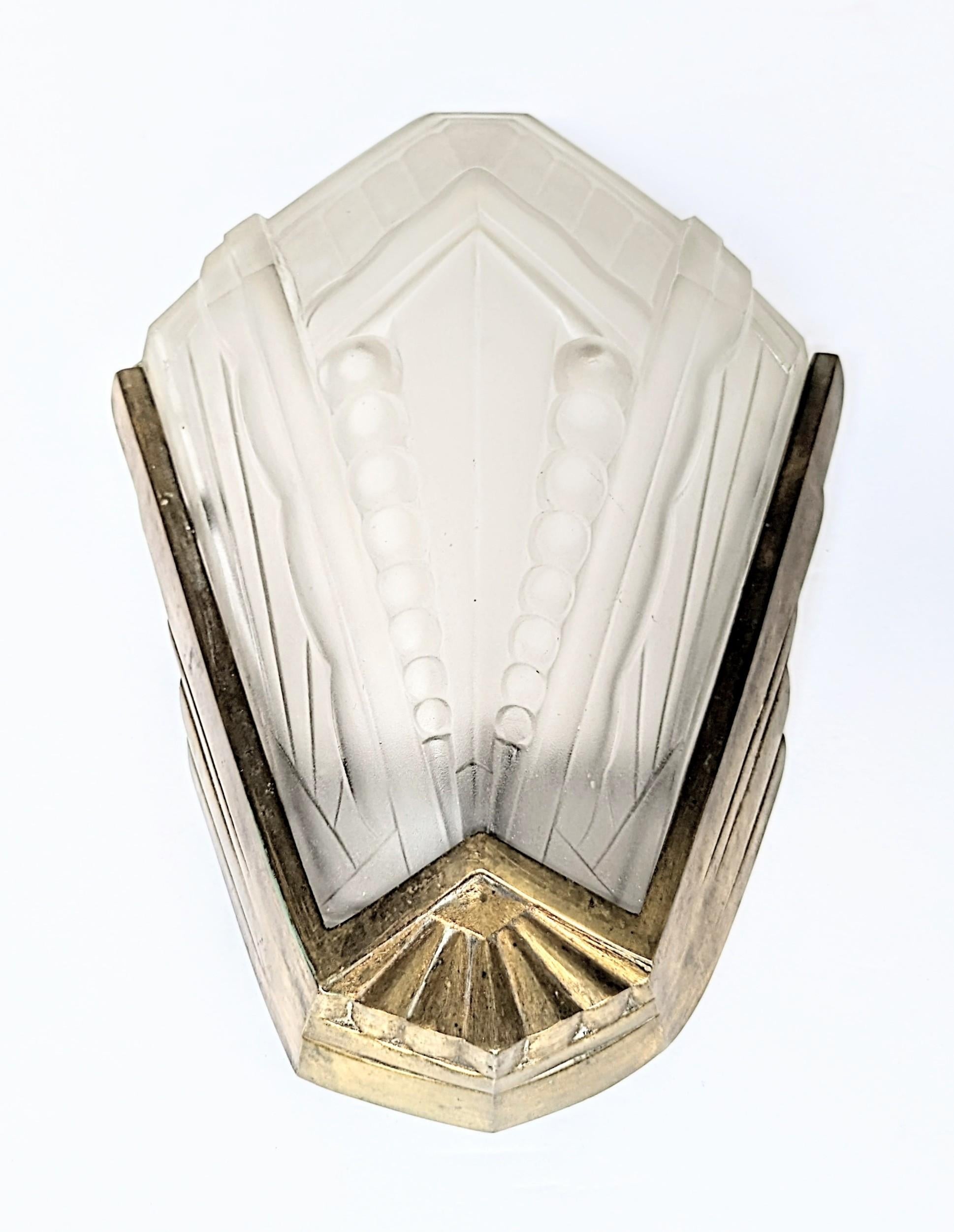 A pair of French Art Deco wall sconces were created by the French Master 