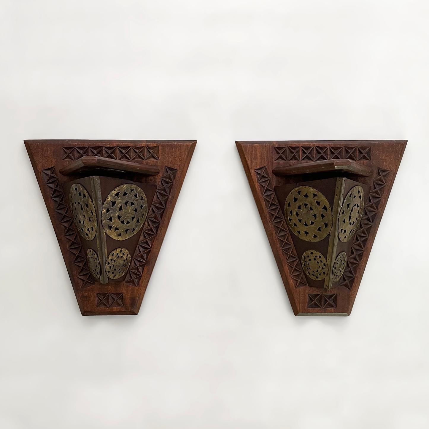 Pair of French Art Deco wood sconces with brass detail
France, circa 1940’s
Large scale wood wall sconces with brass details
Each sconce is handmade and unique in it’s composition
Brass details have various levels of patina from age and use
One