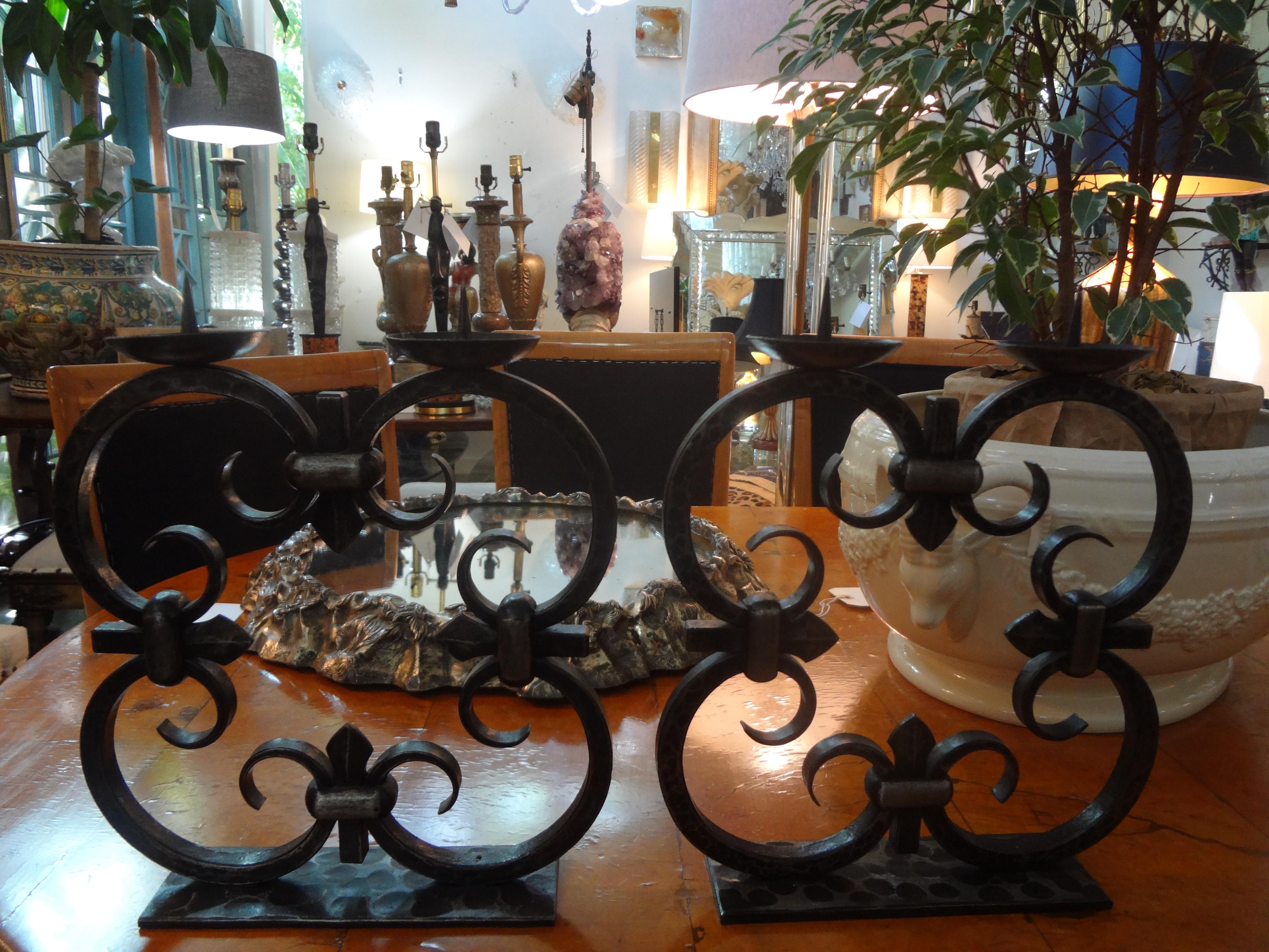 Beautiful rare large pair of French Art Deco hand forged wrought iron candelabra, candlesticks or candleholders by Michel Zadounaïsky. These candleholders are stamped with the maker's mark.

Michel Zadounaïsky (1903-1983) was Russian born and