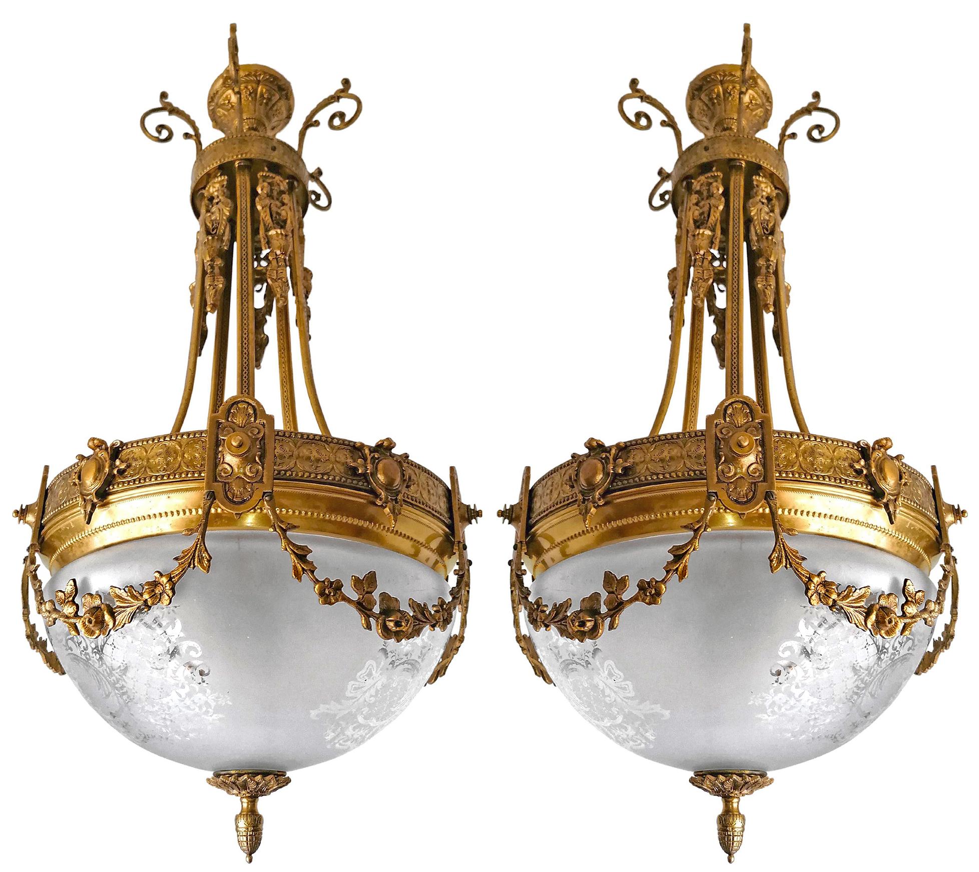 A pair of wonderful gilt bronze and etched-glass three-light ceiling fixture decorated with fine ornaments and garlands, France, early 20th century.
In very good condition - original etched-glass shades without damages, bronze with beautiful