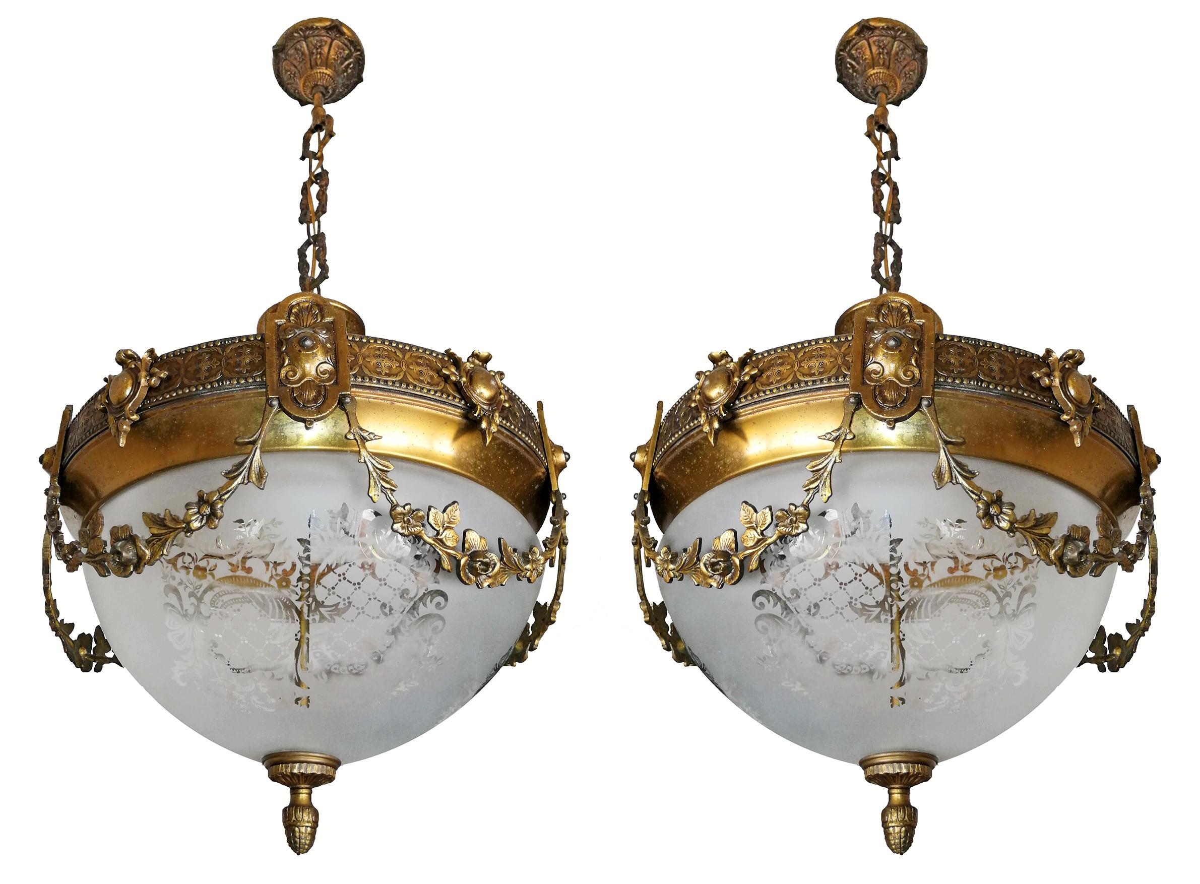 A wonderful pair of gilt bronze and etched-glass two-light ceiling fixtures decorated with fine ornaments and garlands, France, early 20th century.
In very good condition - original etched-glass shades without damages, bronze with beautiful