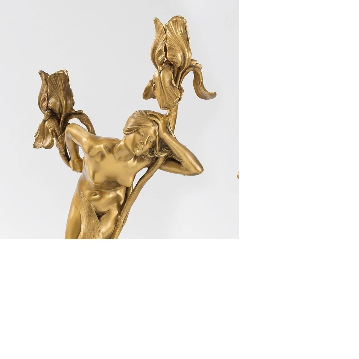 A pair of French gilt bronze candelabra, 