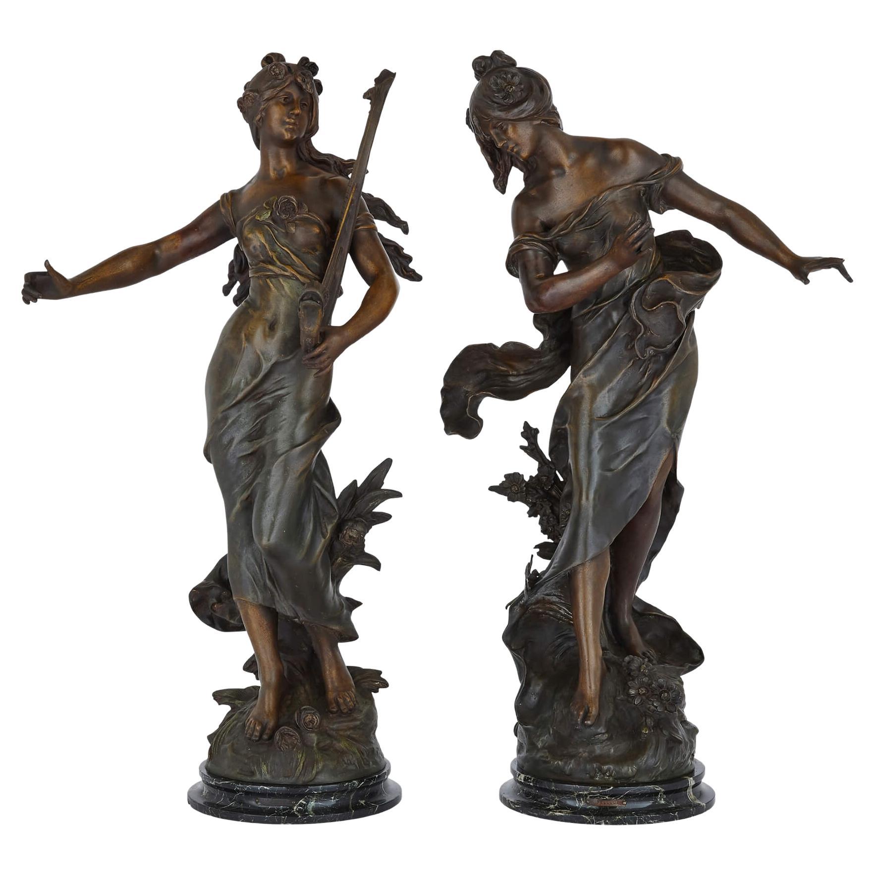 Paar französische Art nouveau-Stil-Skulpturen aus patiniertem Zinn