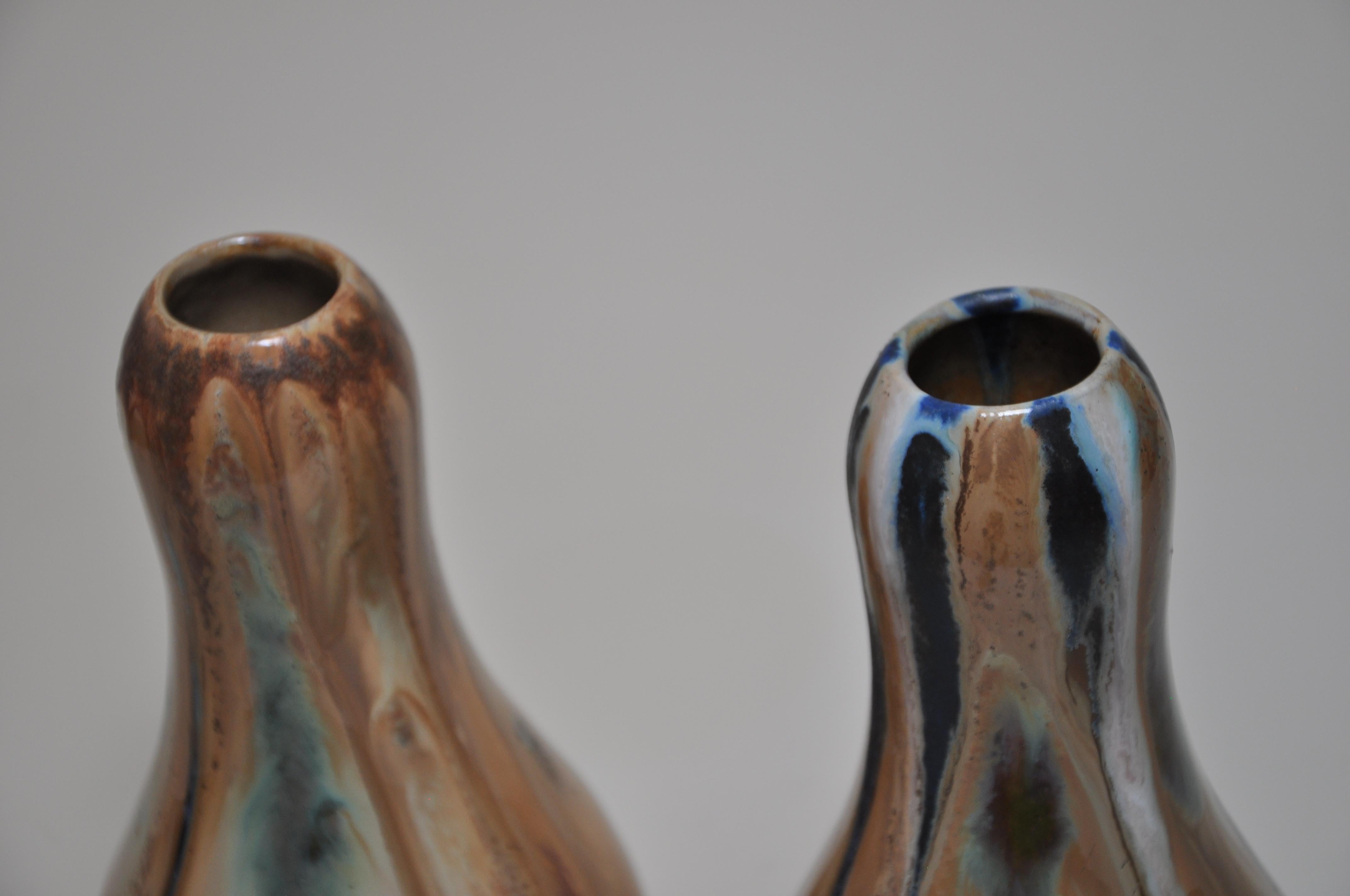 Pair of French Art Nouveau vases by Alfonse Cytere of Rambervillers green ochre navy blue 

Two very attractive ceramic vases by Alfonse Cytere made at his Rambervillers works, in the form of gourds, of Japanese inspiration with complimentary