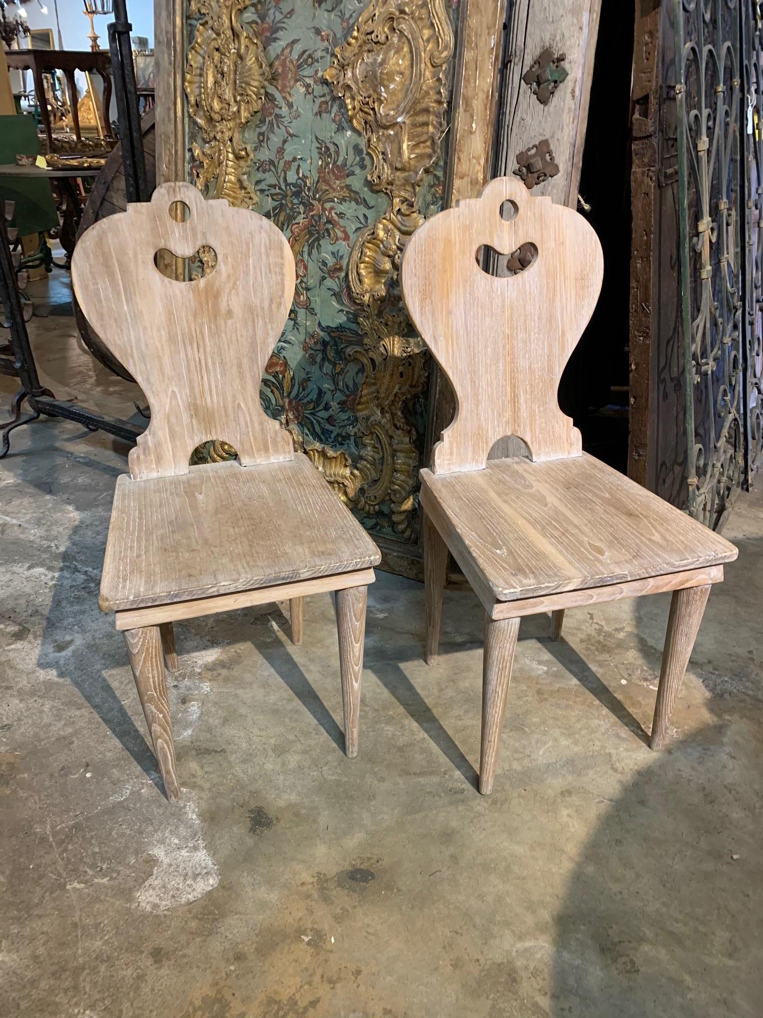 Pair of Arte Populaire - Folk Art dining chairs from the Ardeche region of France. Soundly constructed from scraped wood with a wonderfully shaped back and tapered legs.