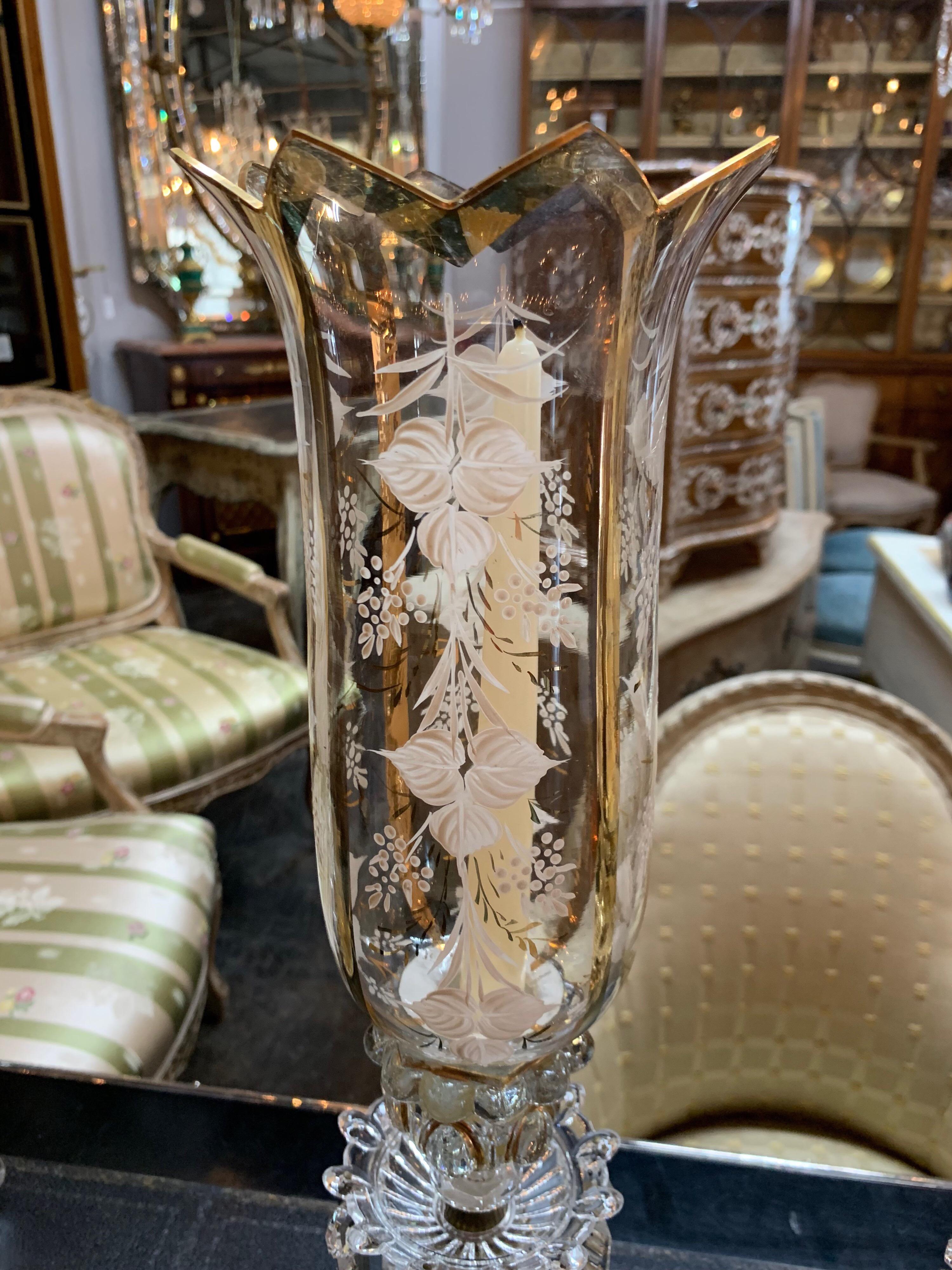 Very nice pair of French Baccarat crystal hurricane lamps with enamel overlay. A beautiful accessory for a fine home.