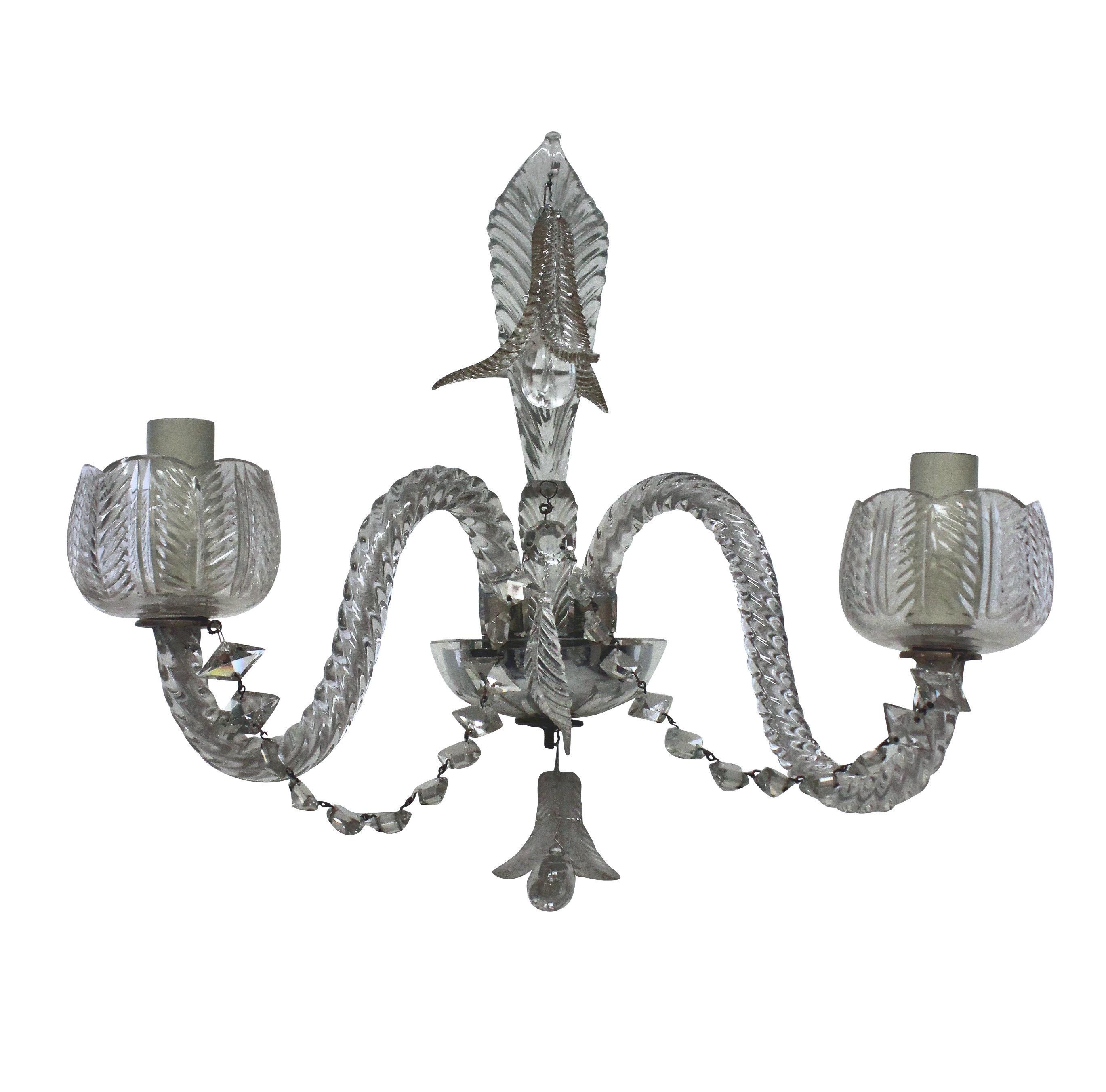 A pair of good quality French Baccarat cut glass, twin branch wall lights, with foliate patterns throughout. With a cut glass leaf at the centre of each, leaf pendants, diamond cut chains and leaf pattern sconce holders.