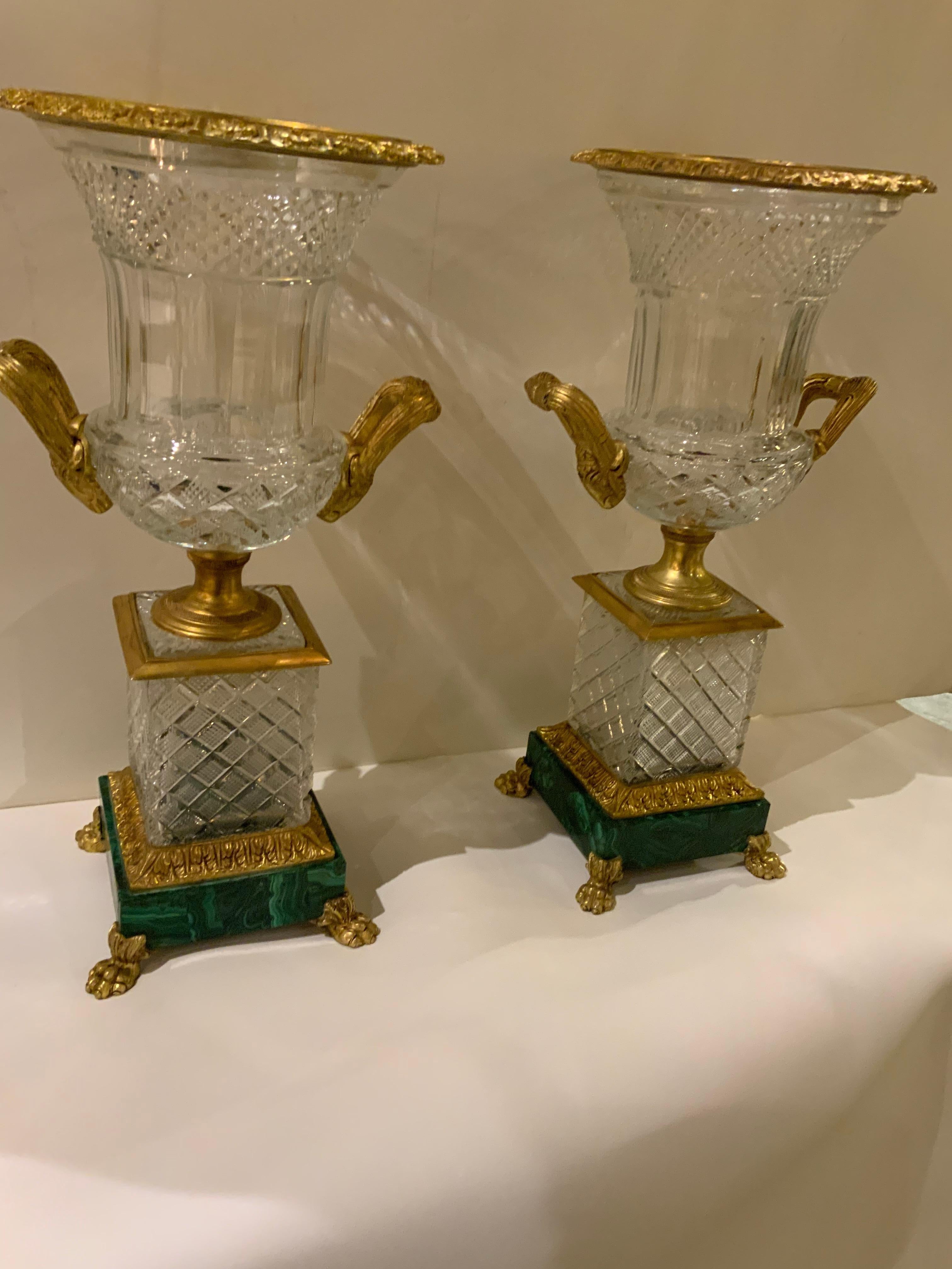 Handsome pair of Baccarat style French urns of cut crystal
With gilt bronze mounts. These urns are mounted on
Dark green malachite bases. The gilt bronze is in a light
Golden hue without blemishes. The cut crystal is very finely
Accomplished
