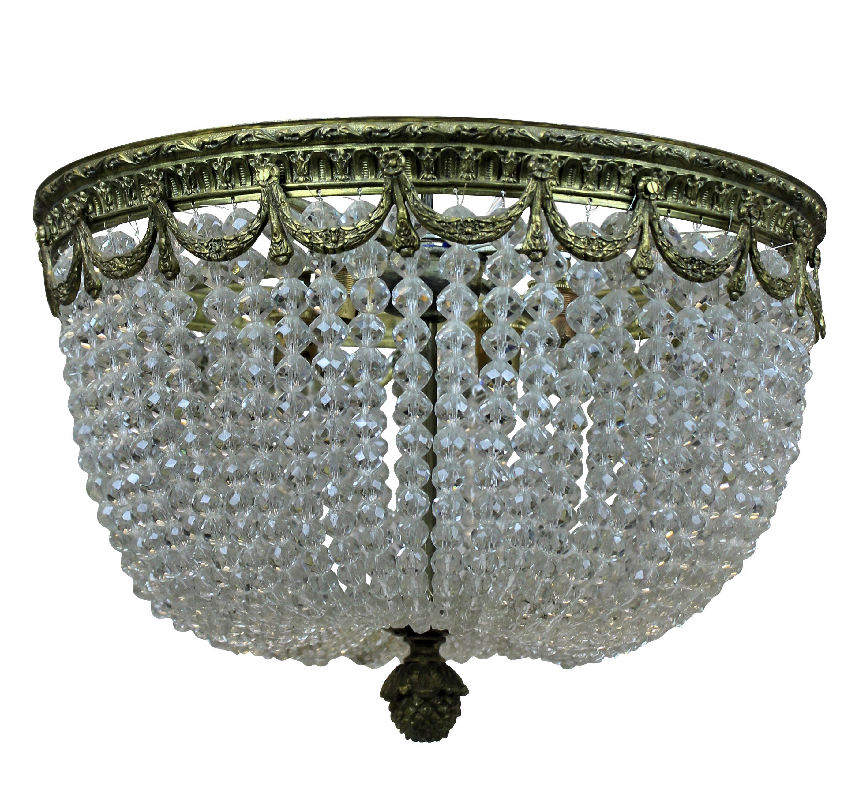 A pair of French 'bag' chandeliers in gilt bronze and cut-glass beads. Ideal for low ceilings.
  