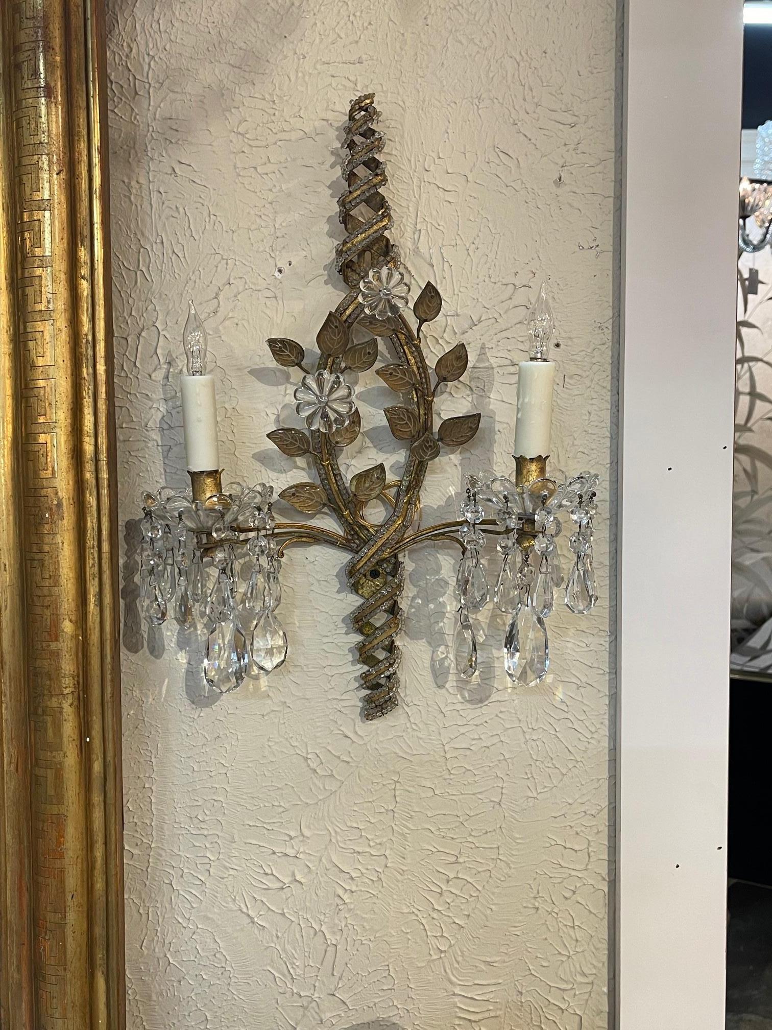 Pair of French Bagues beaded crystal and gilt metal 2 light sconces. Circa 1940. The sconces have been professionally rewired and ready to hang. A fine addition to any home!