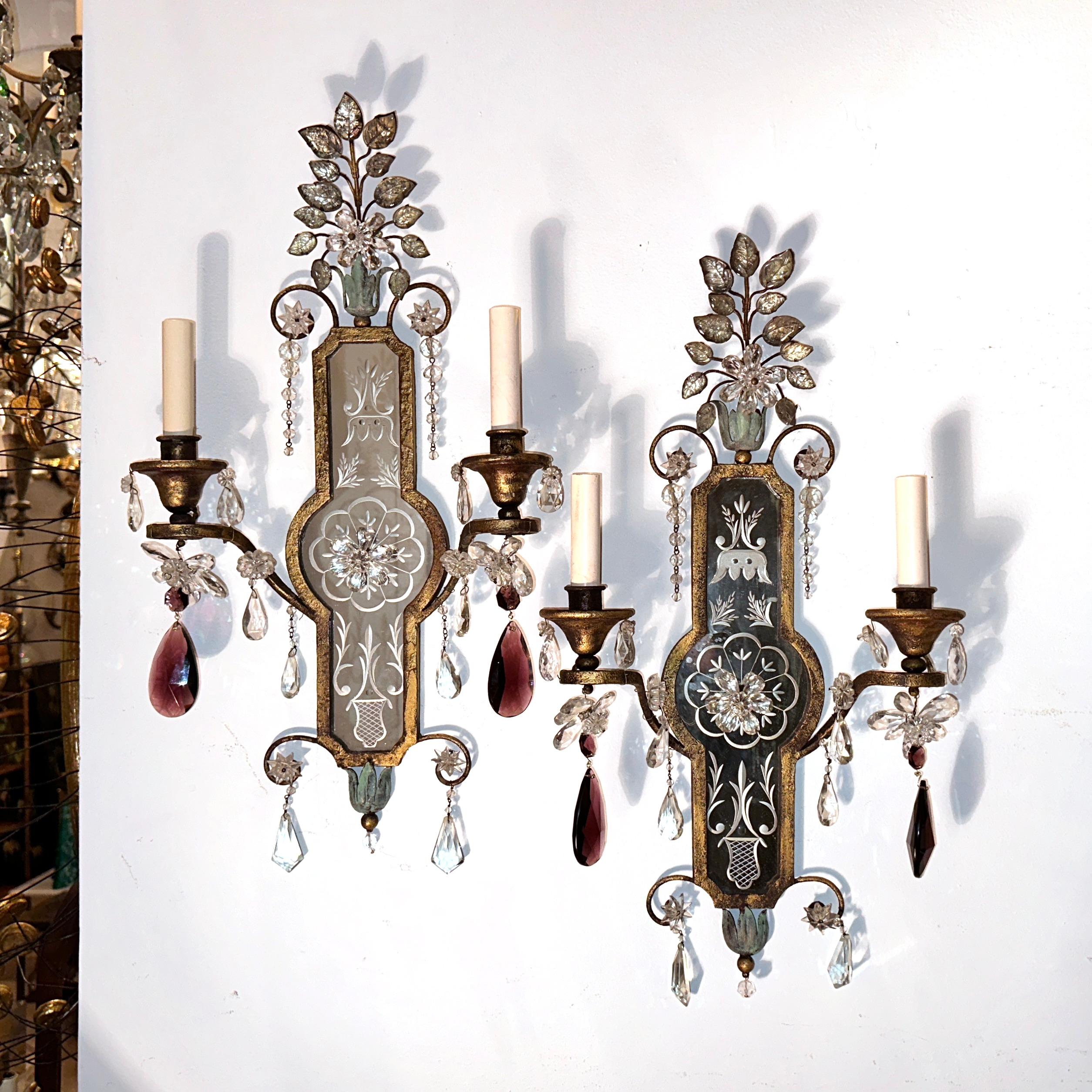Pair of circa 1940's French gilt metal sconces with mirrored backplates and crystal drops.

Measurements:
Height: 24