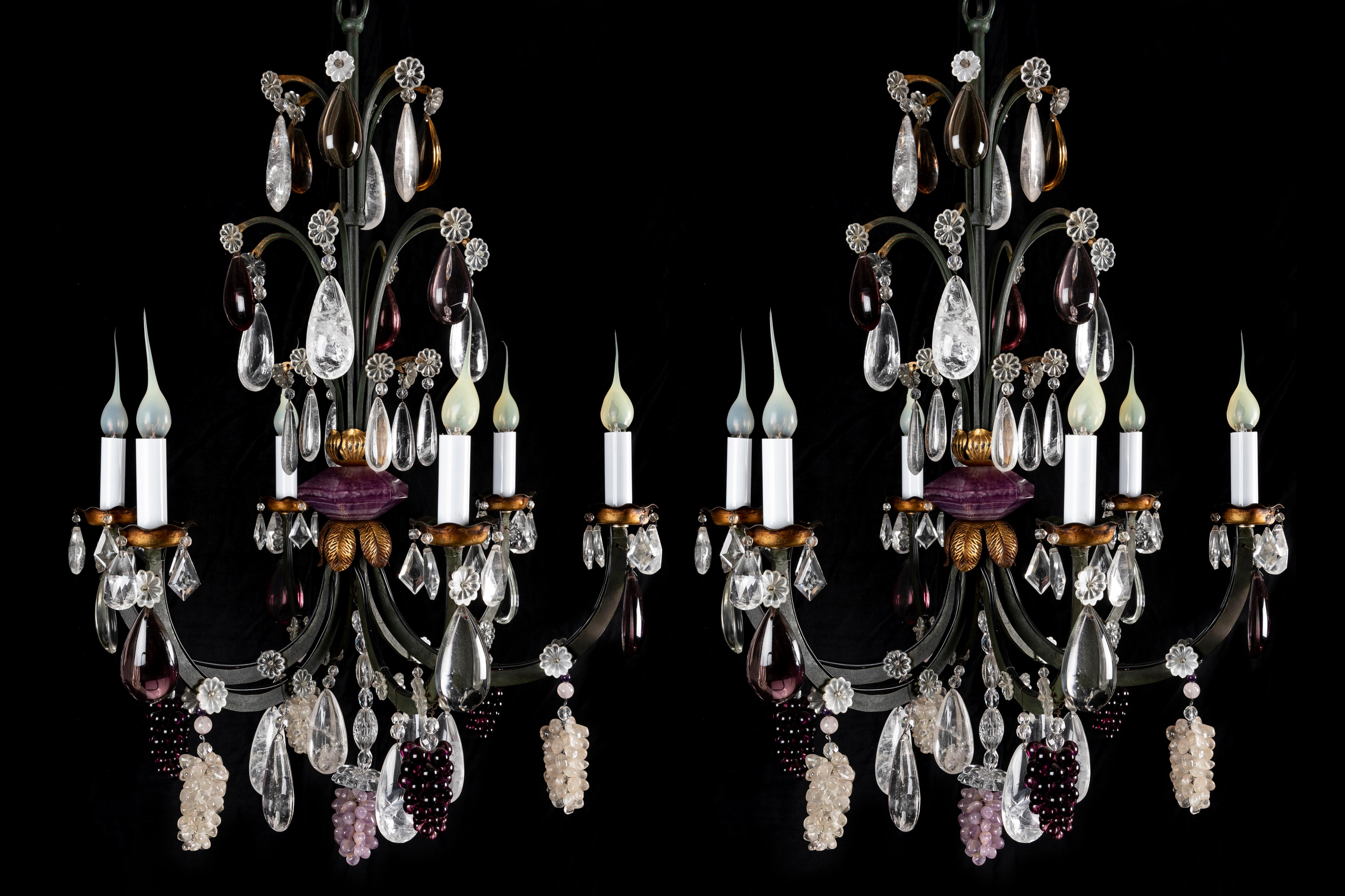 A Pair of Unusual French Bagues Style green patinated bronze and cut rock crystal fruit chandeliers of exquisite detail. This pair of fine chandeliers are embellished with cut rock grapes, amethyst rock crystal grapes, amethyst glass grapes, further