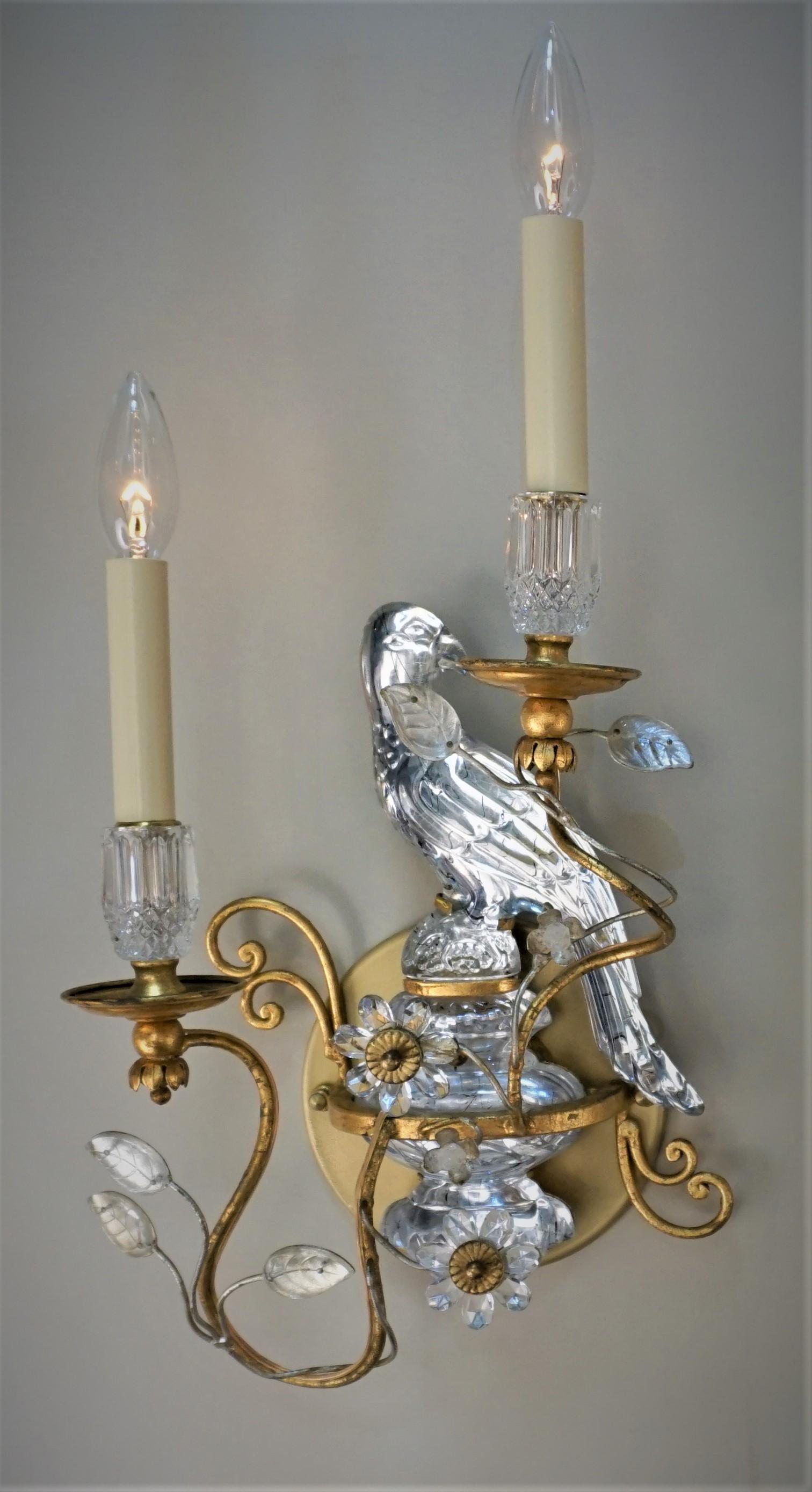 Beautiful pair of gilt metal and crystal parrots' and flora design wall sconces.
Back plates have been added to cover your electrical box.