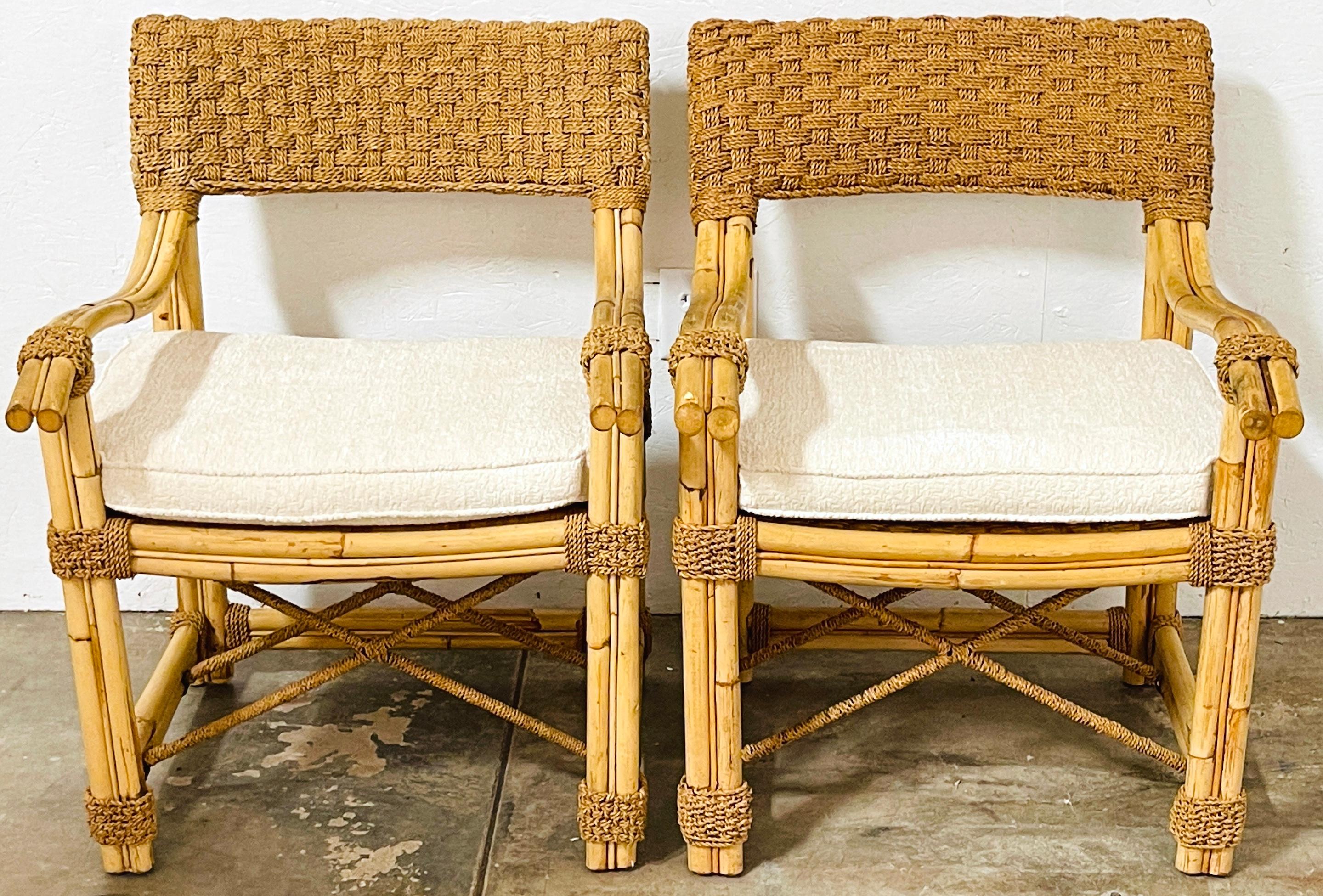 Pair of French Bamboo & Woven Seagrass Armchairs with Bouclé Seat Cushions 
France, Late 20th Century 
Offering exotic French elegance and comfort, this pair of Late 20th Century French bamboo & woven seagrass armchairs embodies sophistication and
