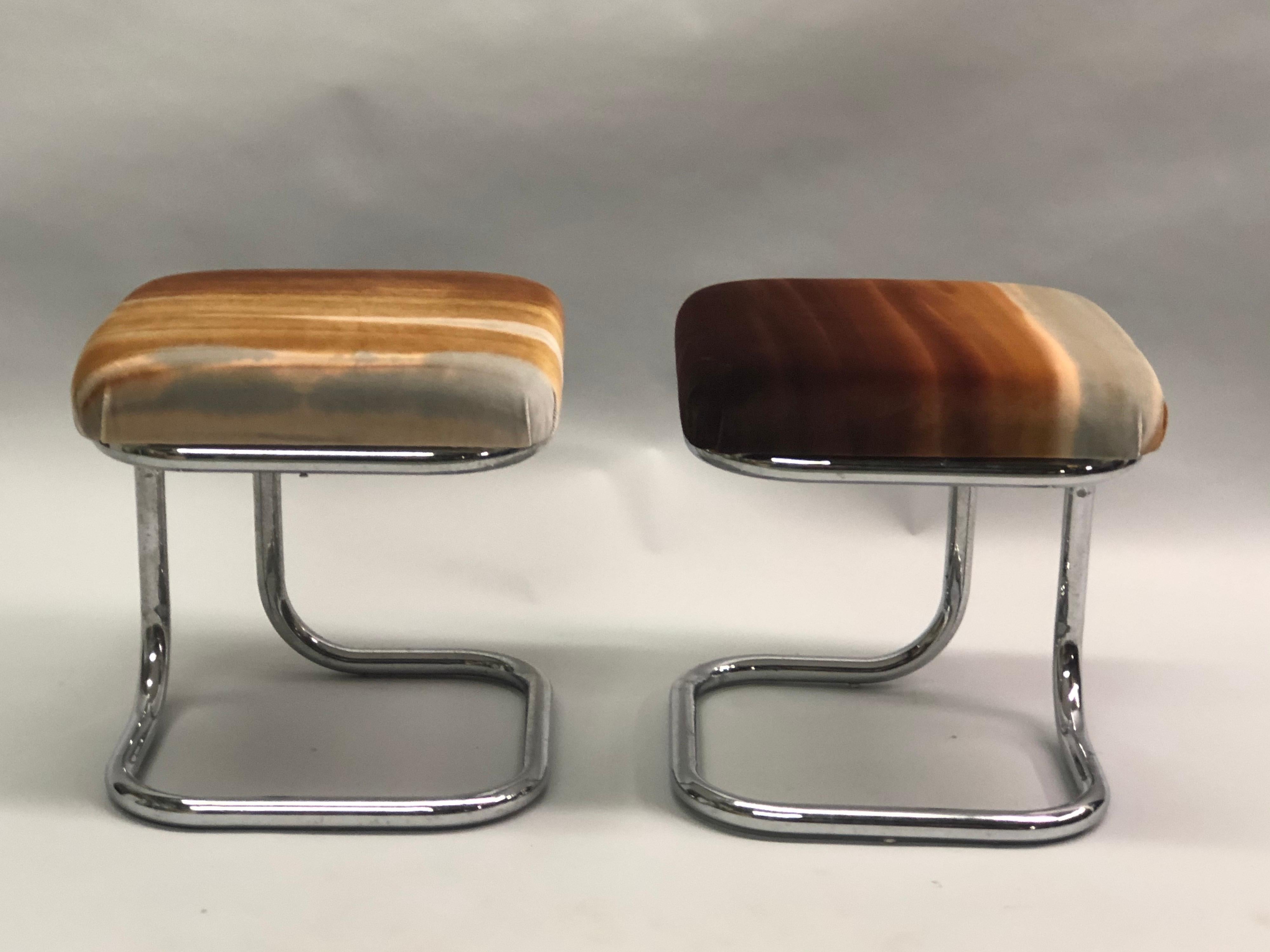 Rare and Exquisite Pair of French Mid-Century Modern Bauhaus style benches / stools fabricated with chromed tubular steel with seat fabric by Hermès. The pieces feature a rare curved tubular steel form.

References: Le Corbusier, Pierre Jeanneret,