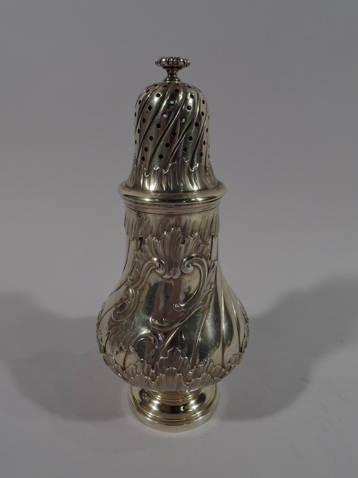 Pair of Belle Epoque gilt 950 silver sugar casters. Made by Odiot in Paris, circa 1880. Each, Baluster with stepped round foot and pierced domed cover. Twisted fluting and feathery, irregular, and overlapping acanthus leaf borders. Asymmetrical