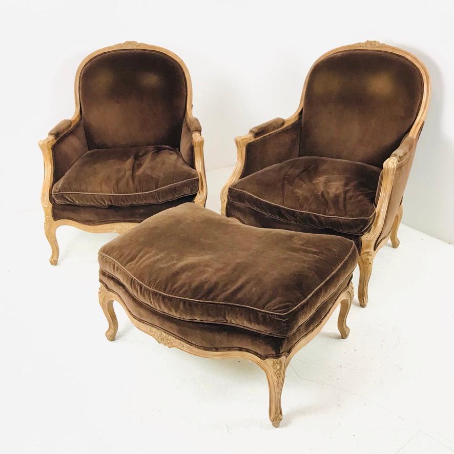 Gorgeous pair of Louis XV style French Bergere chairs with ottoman. Some cosmetic wear to upholstery, good structural condition. 
32
