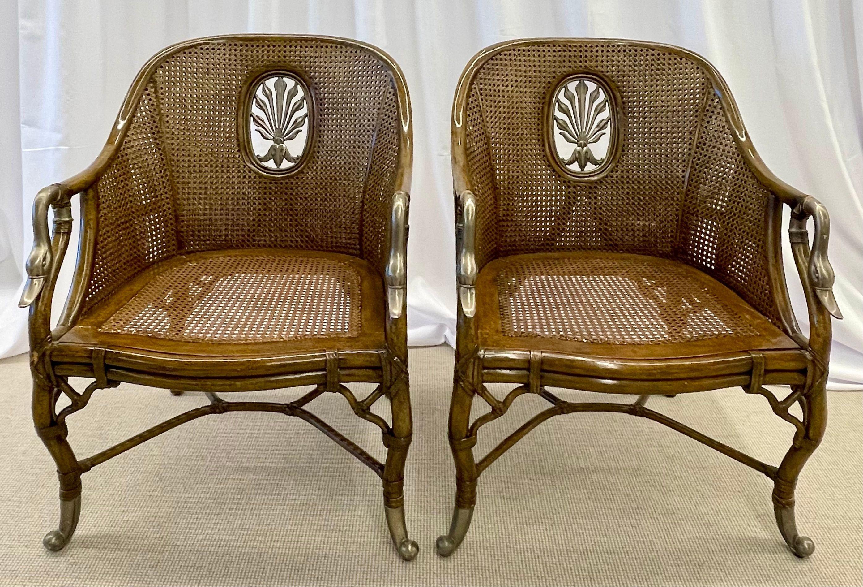Pair of French Bergère Swan Arm, Lounge, Side Chairs, Silver Metal Cast, Cane. Each in a faux bamboo tortoise shell painted frame of double caning with silver gilt metal Swan Form had rests. The backrests with fleur de lis silver metal design. The