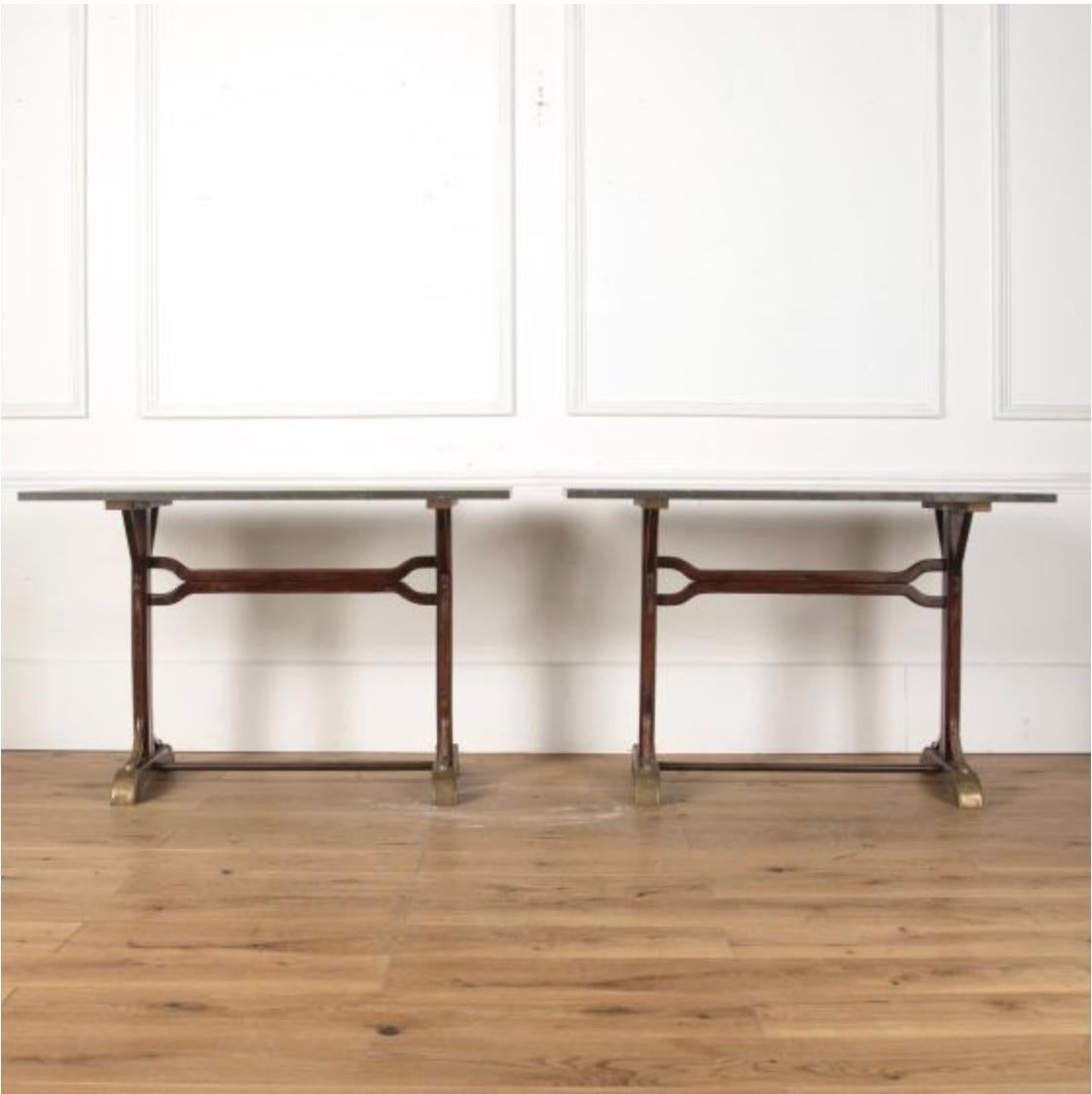 French bistro tables with blue stone tops & bentwood bases.