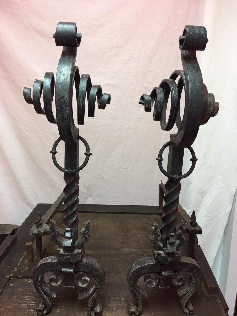 Pair of French black iron scroll top andirons, 19th century.