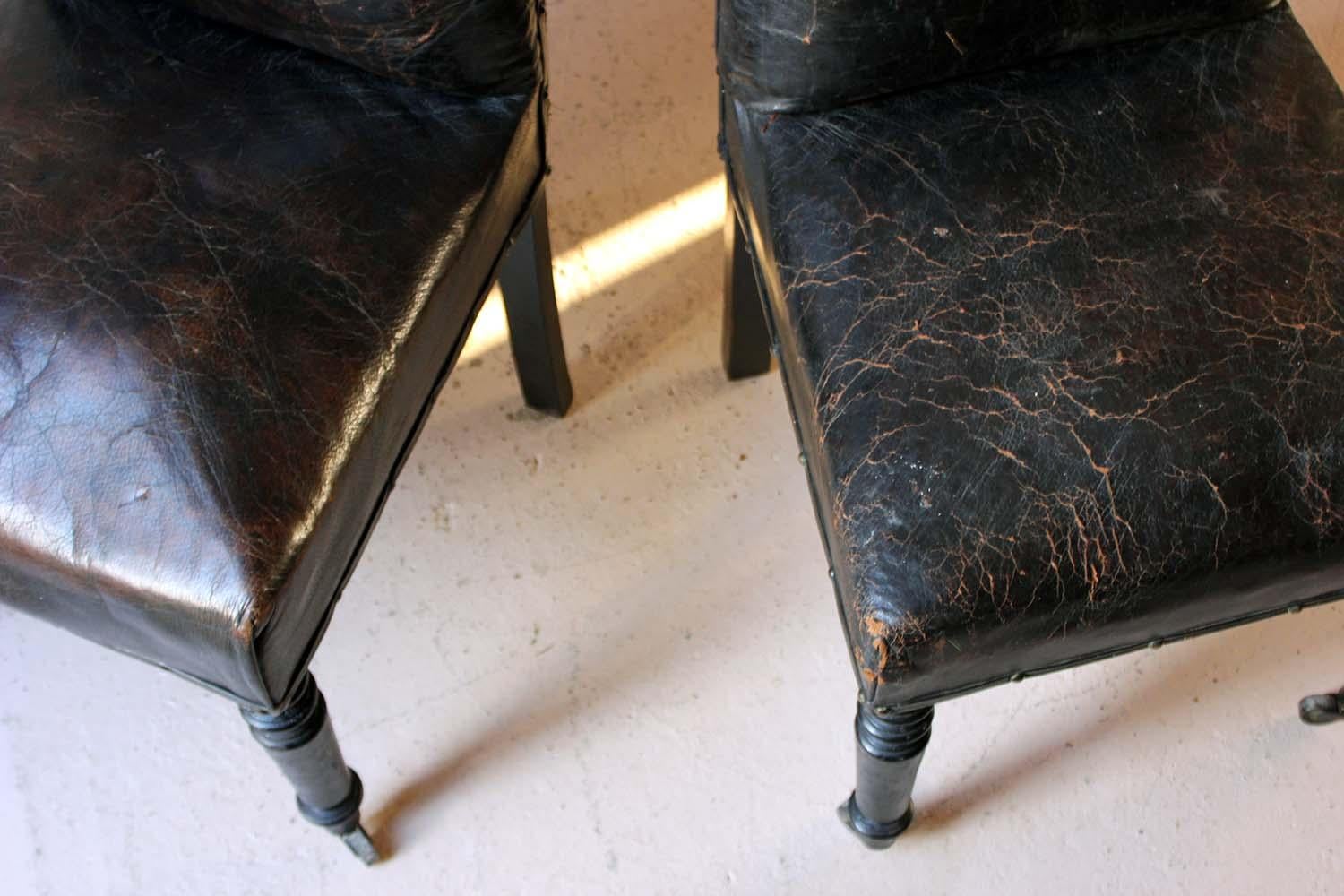 Late Victorian Pair of French Black Leather Upholstered and Ebonized Library Chairs, circa 1880