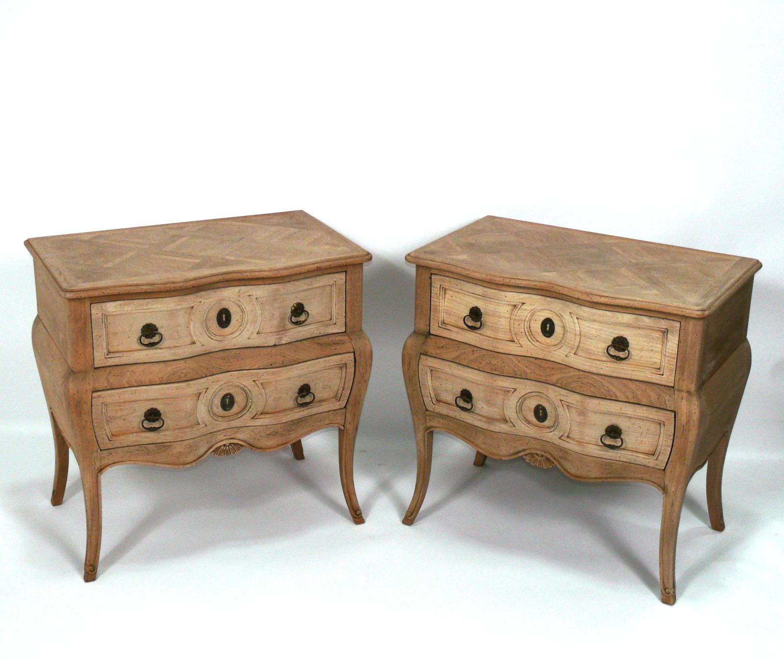 Pair of elegant French bleached oak parquet nightstands, France, circa 1950s. These are a versatile size and can be used as nightstands, or as end or side tables. They were imported by Auffray and Company of New York City.