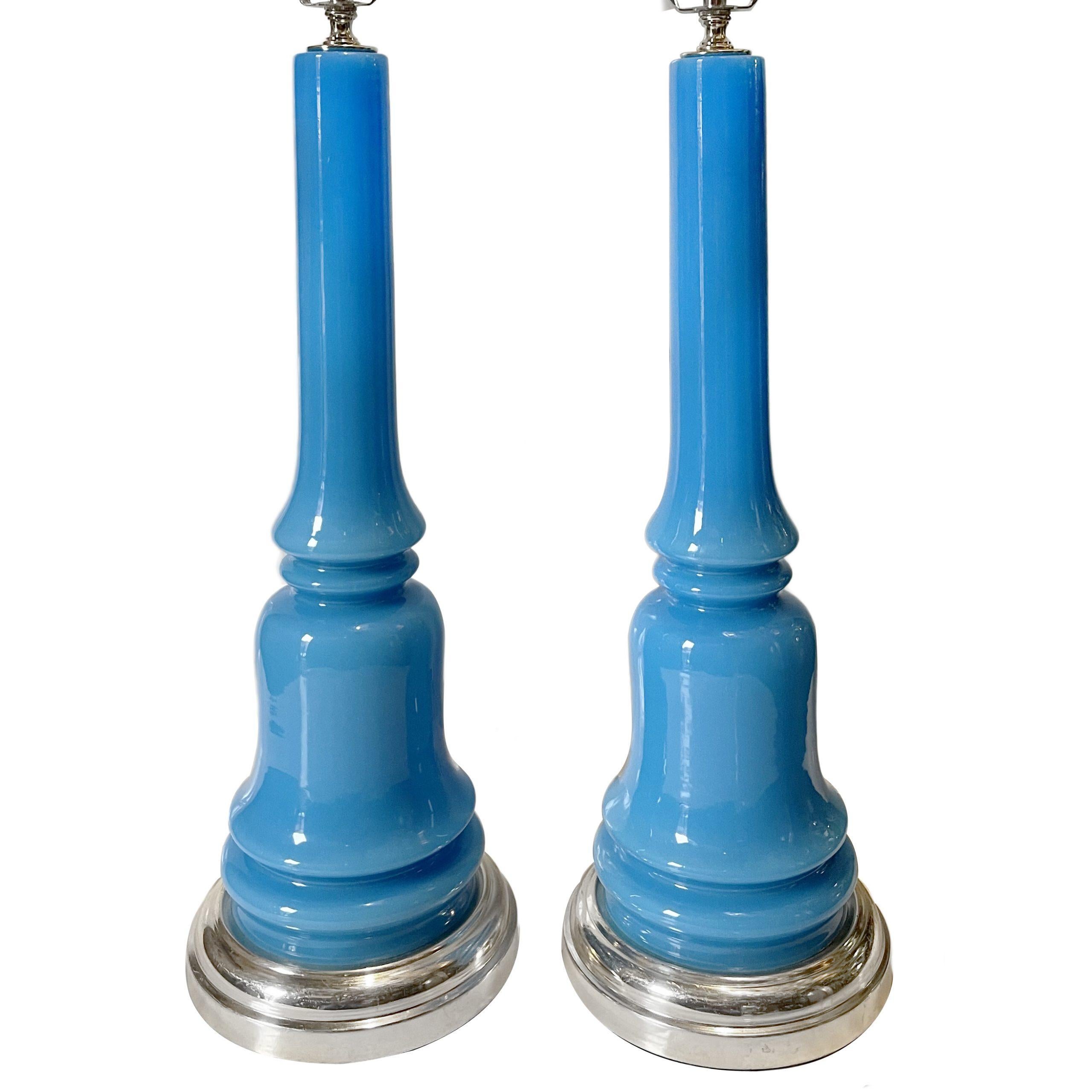 Pair of circa 1950s French blue glass table lamps with nickel-plated bases.

Measurements:
Height 22