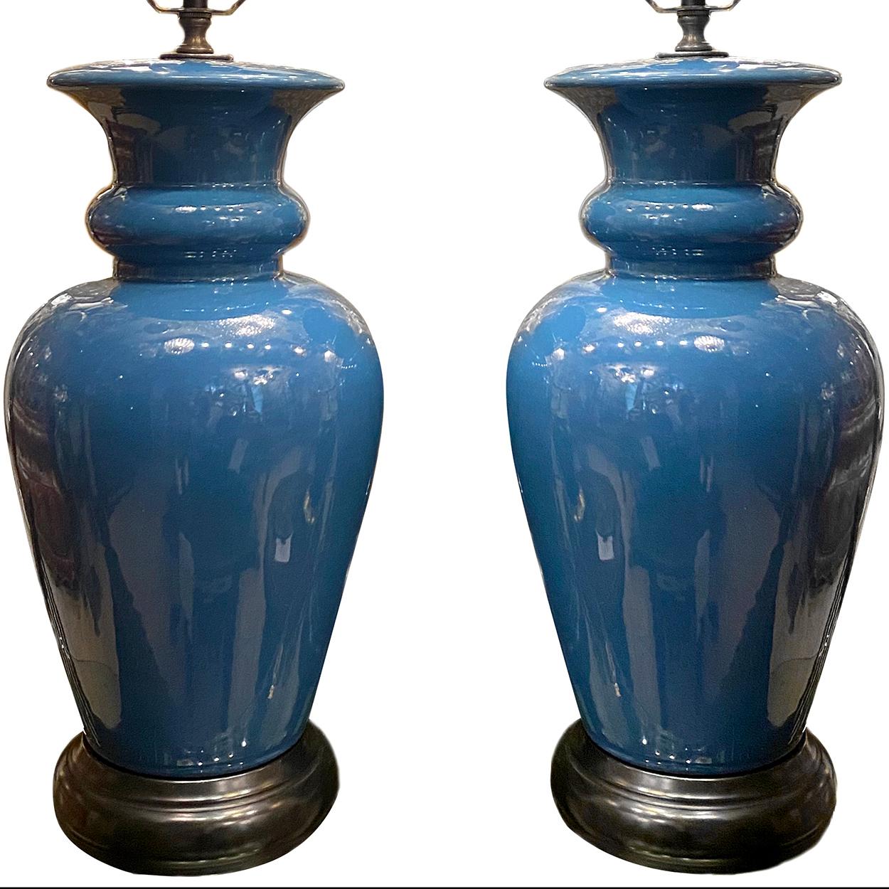 A pair of circa 1960's French porcelain table lamps.

Measurements:
Height of body: 17
