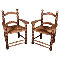 Pair of French bobbin armchairs in the style of Charles Dudouyt, 1940-50s