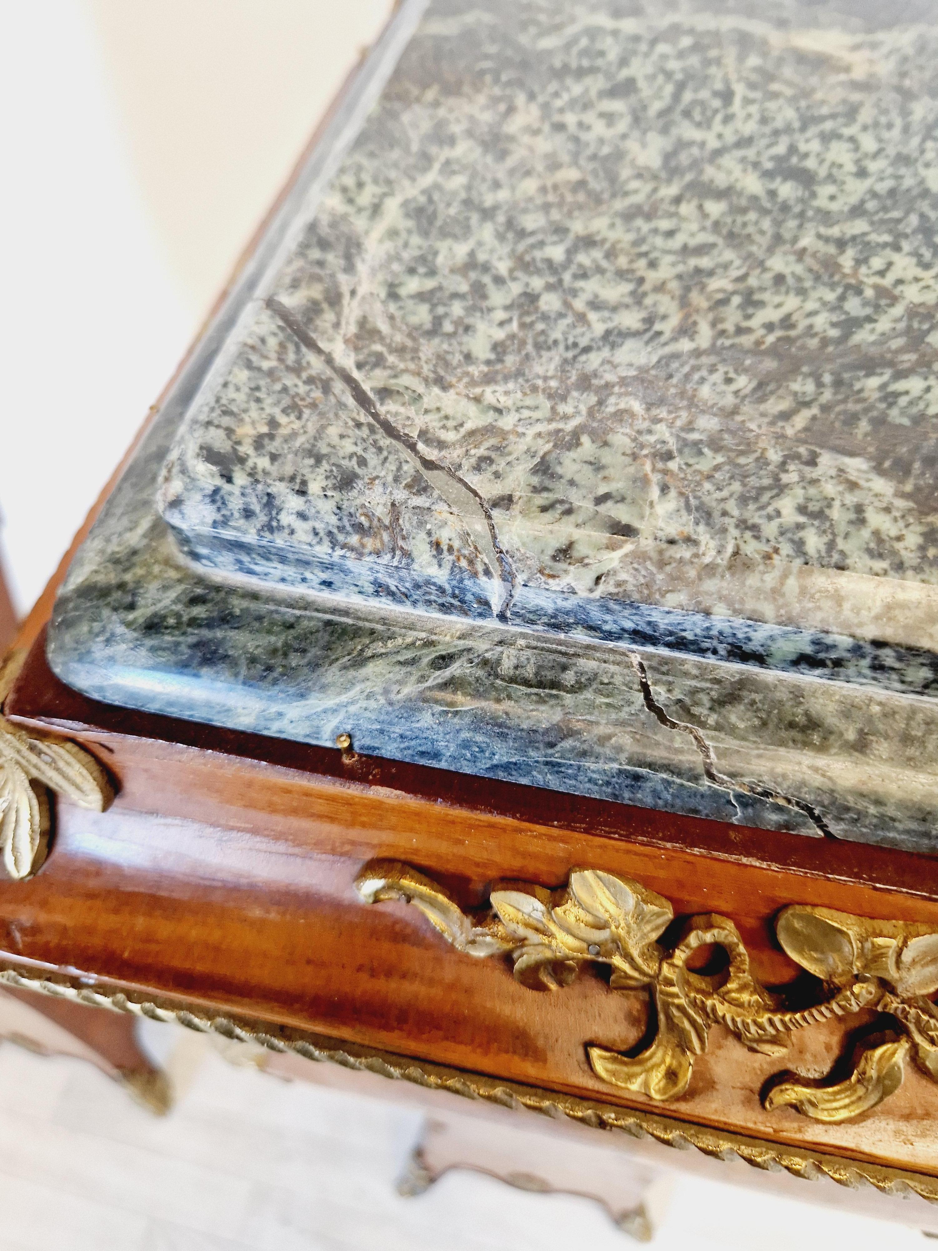This pair of French Bombe pedestals is a stunning addition to any antique collection. Crafted from wood, with Rosewood veneer these original stands are a beautiful example of French style from the early 1900s. The bombe shape of the bust stands make