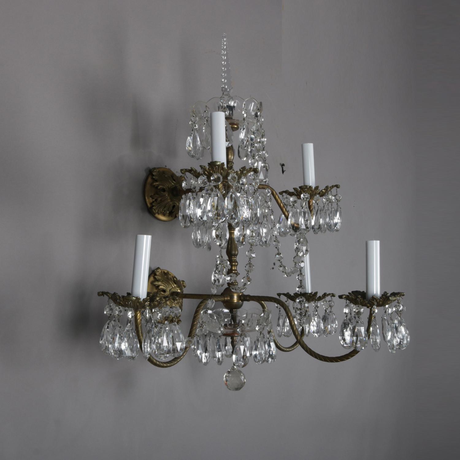 A pair of French electric wall sconces feature two tier brass branch chandelier form each with five candle lights and highlighted with hanging rock cut crystals, 20th century

Measures: 27