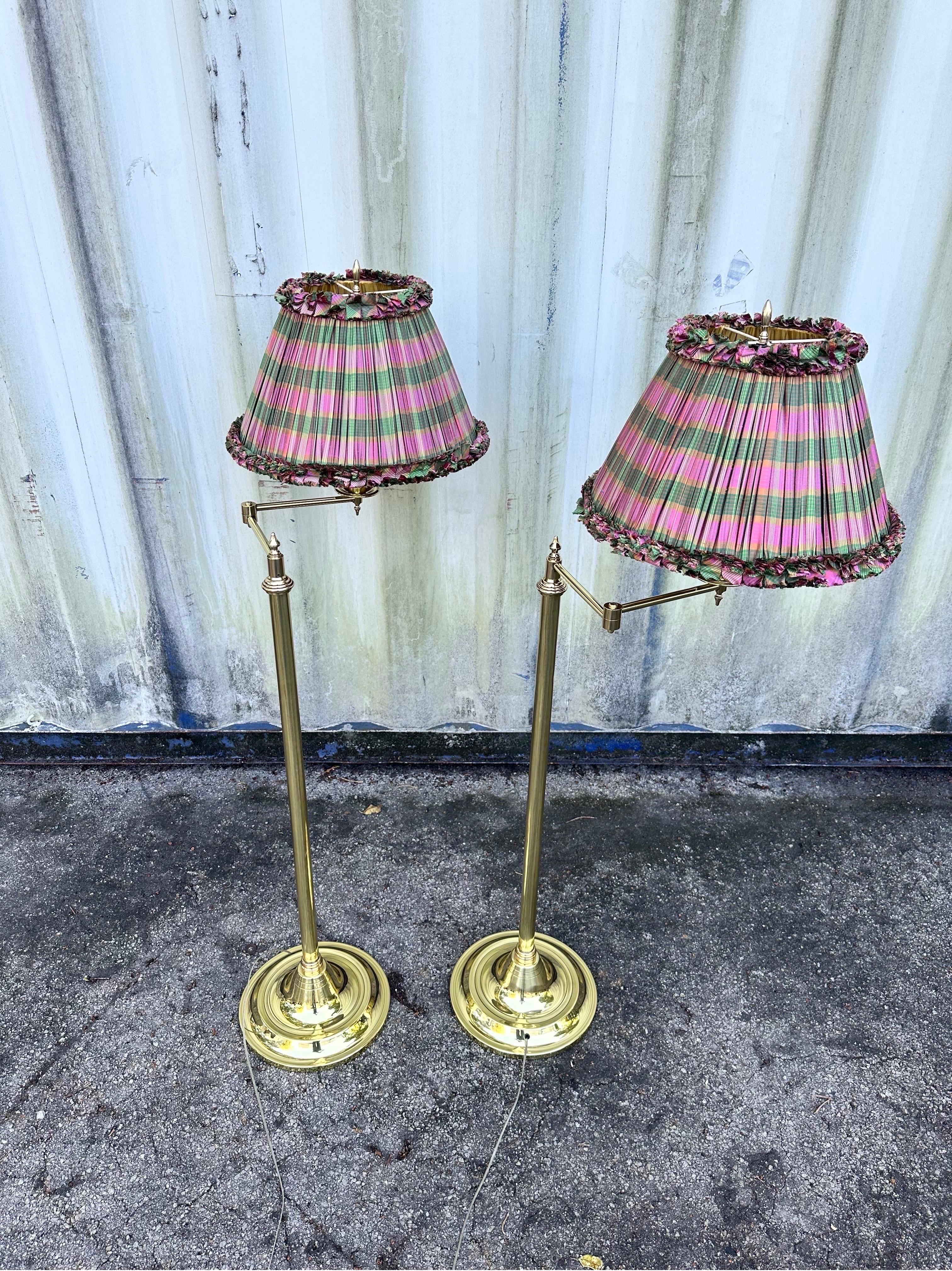 Pair of  high quality French Brass floor lamps from a Palm Beach Mansion.
Fully refinished and rewired.
Adjustable stem.
Minimum 55 inches 
Maximum 66 inches 