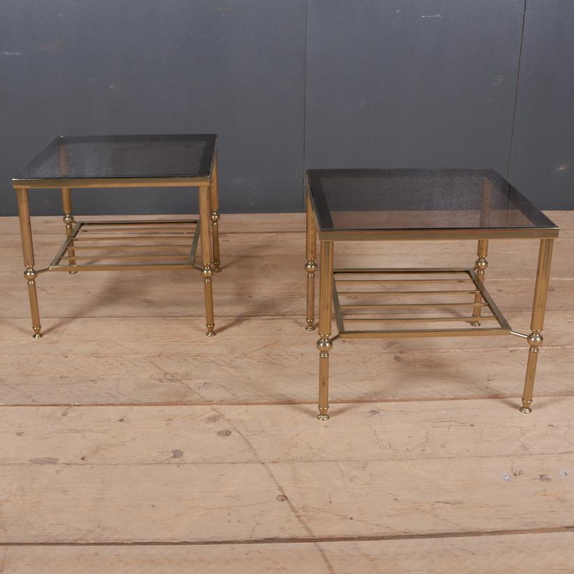 Pair of 1950s French brass and smoked glass lamp tables with slatted underteirs, 1950.

Dimensions
18 inches (46 cms) wide
18 inches (46 cms) deep
16 inches (41 cms) high.

   