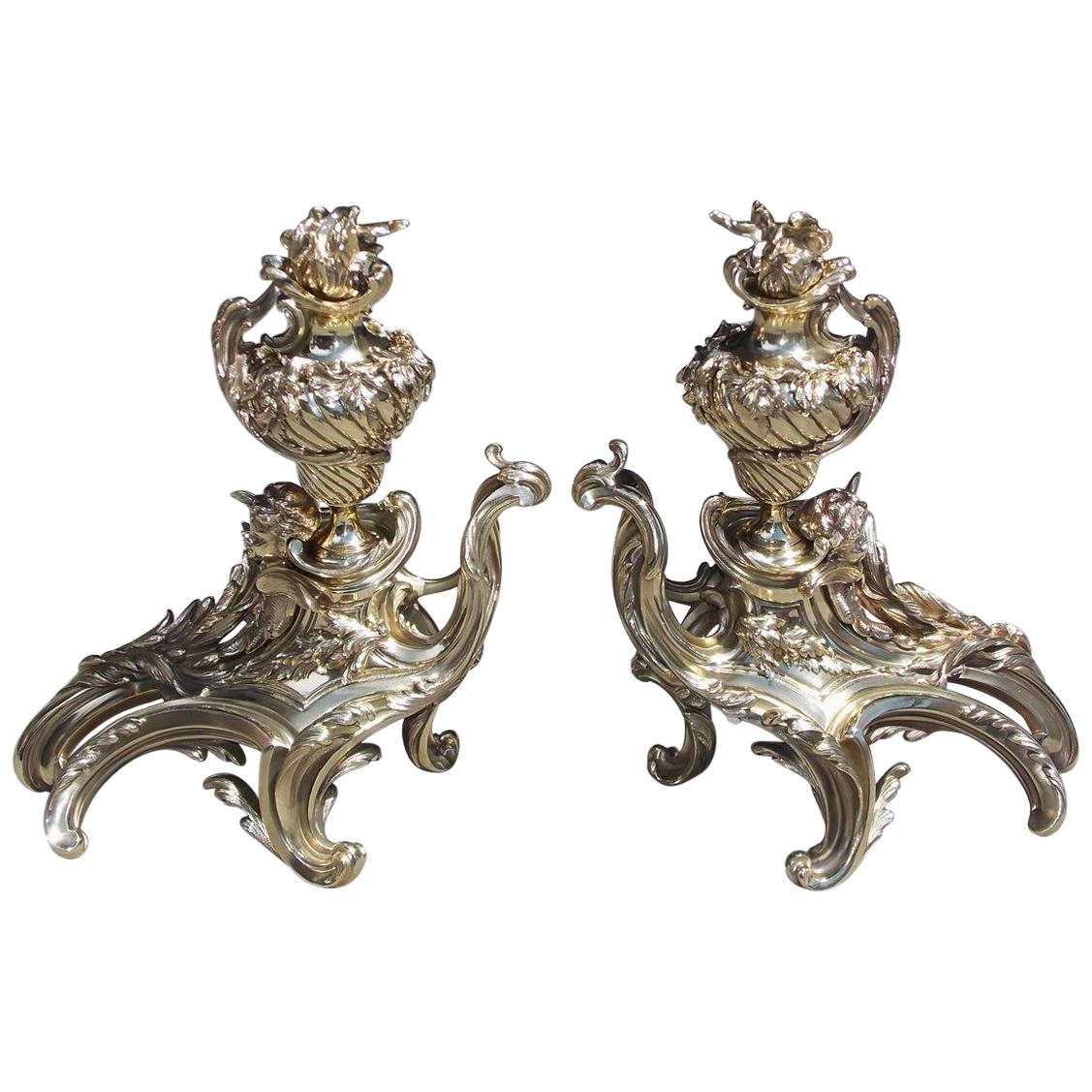 Pair of French Brass Flame Urn Finial and Winged Cherub Floral Chenets, C. 1820 For Sale
