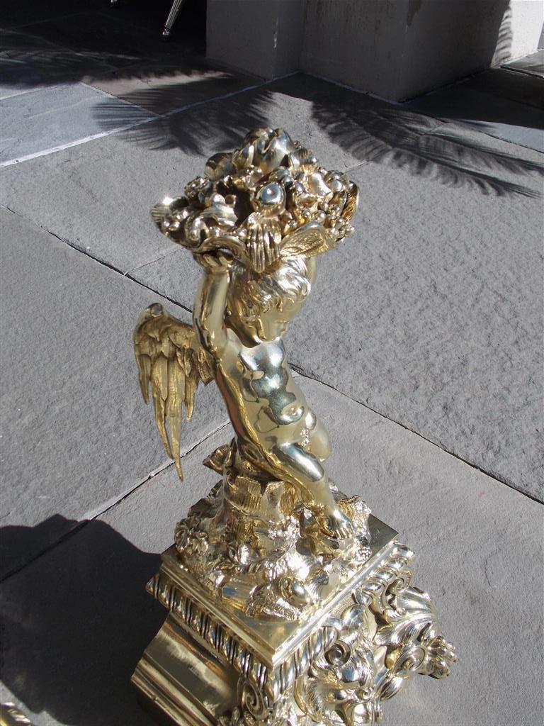 Cast Pair of French Brass Flanking Cherub Fruit Shell Andirons with Paw Feet C. 1815