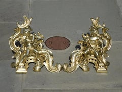 Pair of French Brass Flanking Figural Musical & Foliage Scrolled Chenets, C 1810