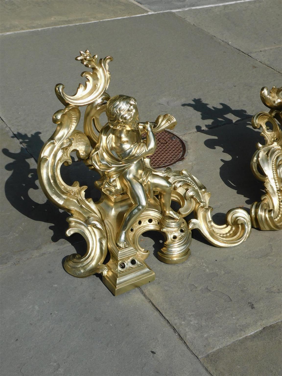 Pair of French Brass Flanking Figural Musical & Foliage Scrolled Chenets, C 1810 In Excellent Condition For Sale In Charleston, SC