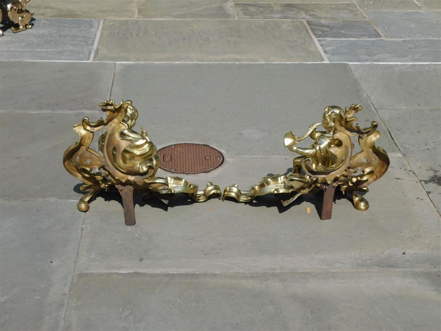 Pair of French Brass Flanking Figural Musical & Foliage Scrolled Chenets, C 1810 For Sale 1