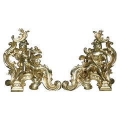 Pair of French Brass Flanking Figural Musical & Foliage Scrolled Chenets, C 1810