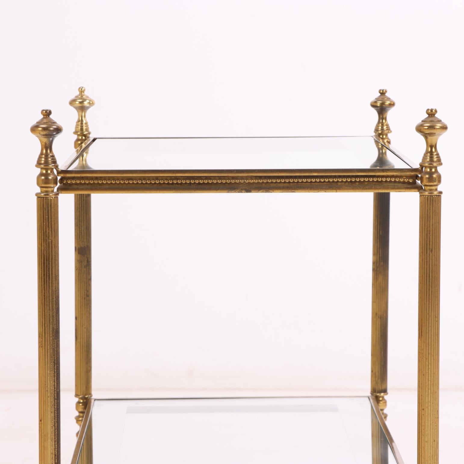 Neoclassical Revival Pair of French Brass Two-Tier Tables, in the manner of Maison Jansen, C. 1960. For Sale