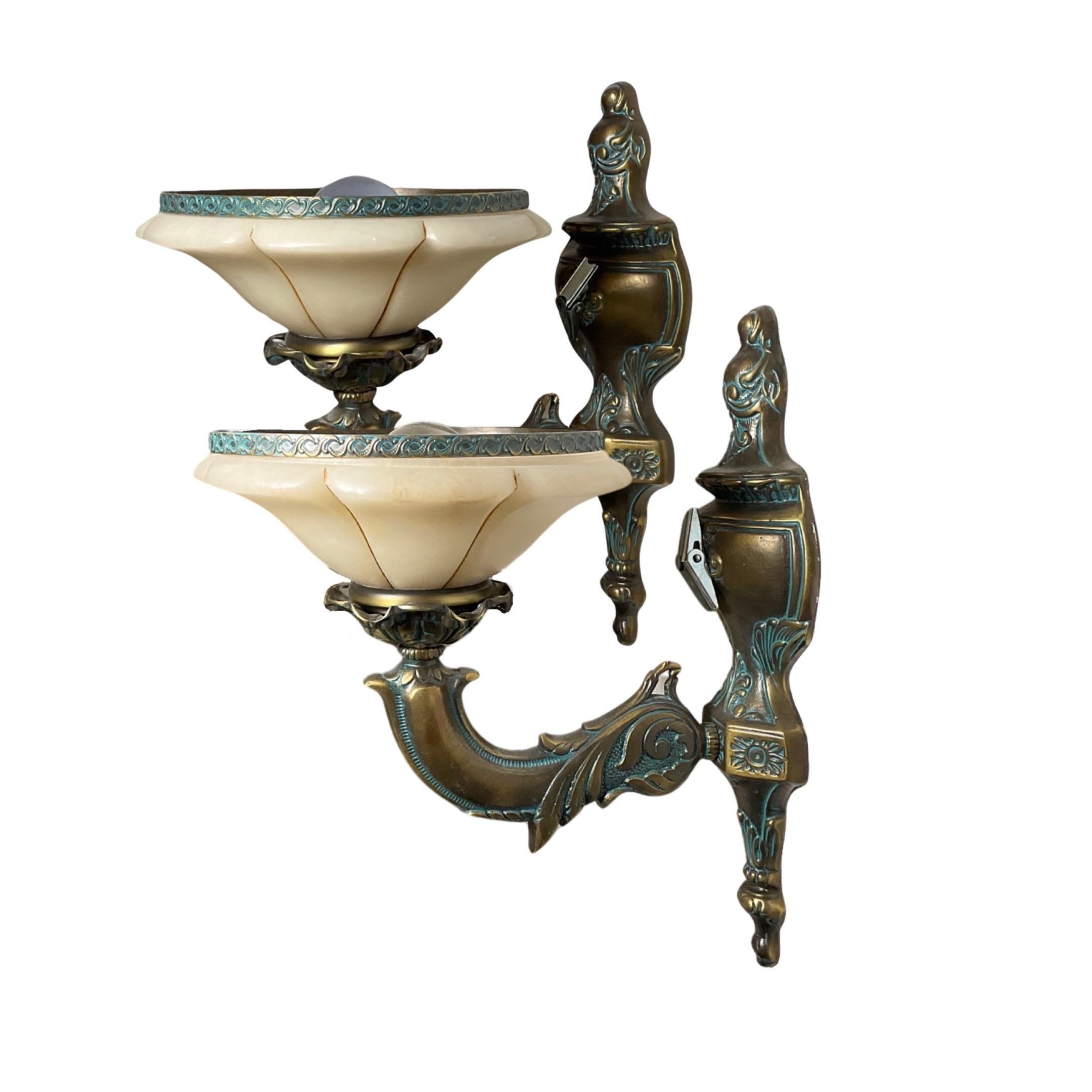 Expertly crafted in France during the 1950s, this pair of sconces features stunning bronze and alabaster construction. Sold as a set, these wired sconces add a touch of vintage elegance to any space.

 

SOLD AS A PAIR 