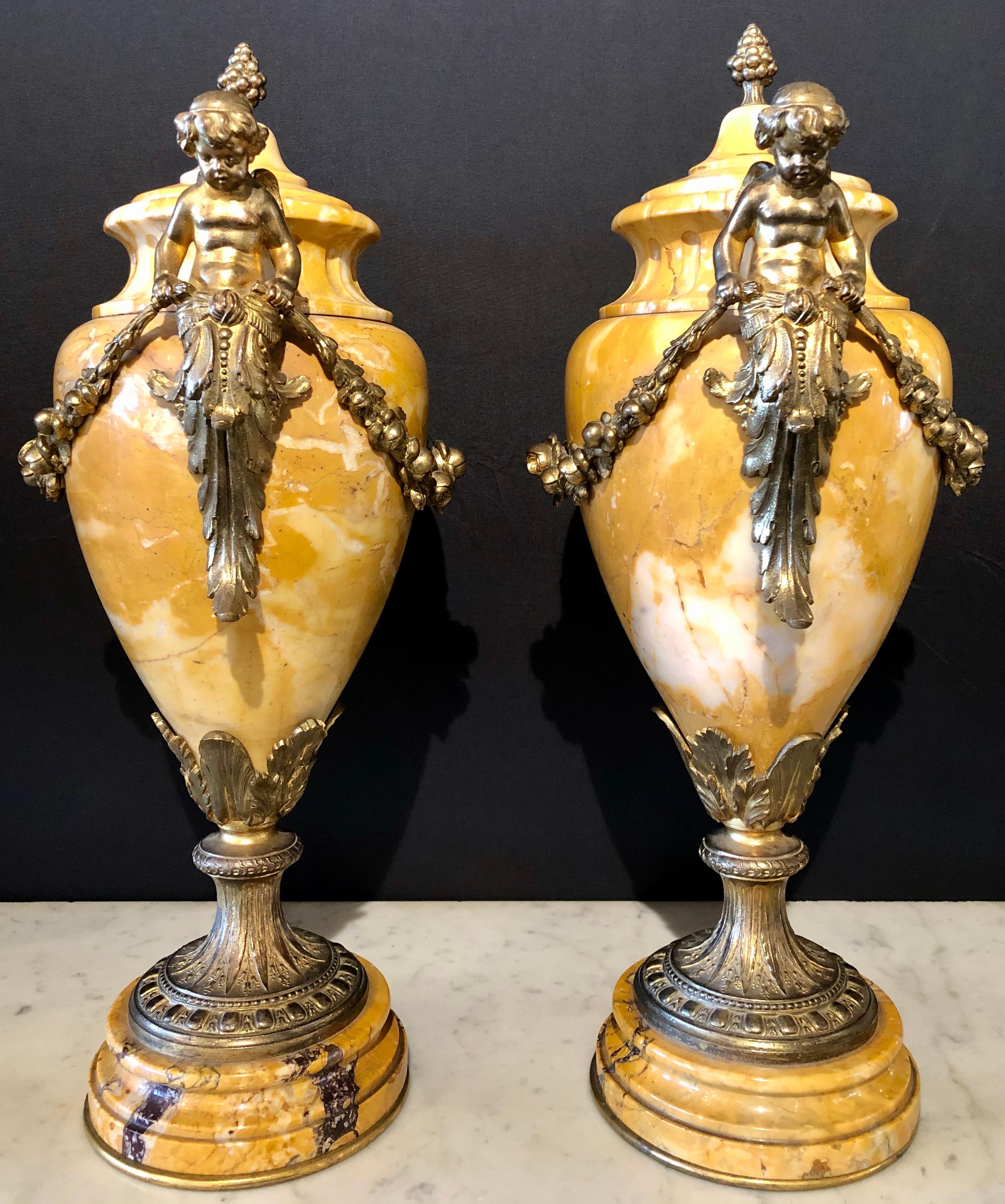 Louis XV Pair of French Bronze and Marble Cassolettes Each with Cherubs