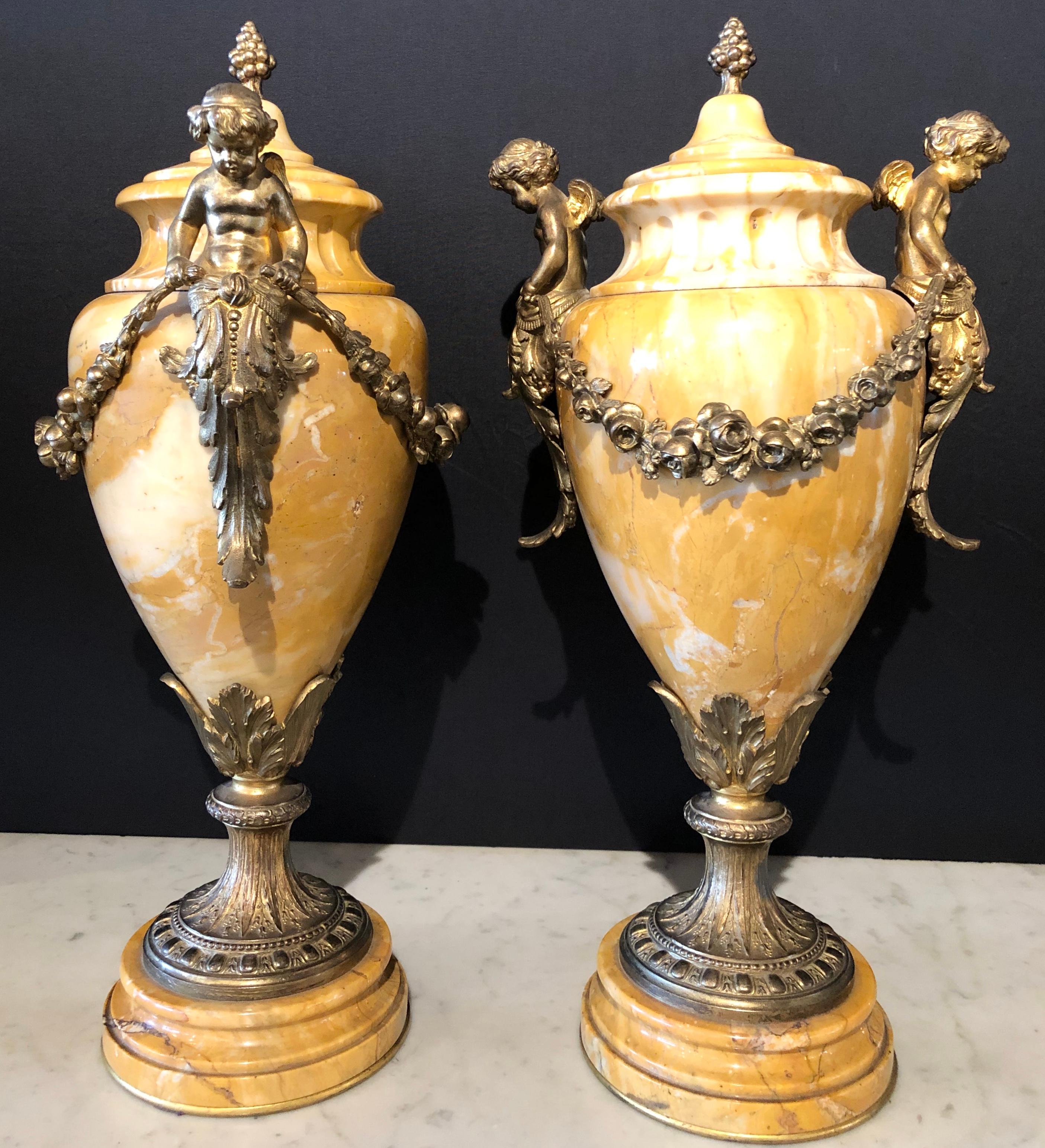 Mid-20th Century Pair of French Bronze and Marble Cassolettes Each with Cherubs