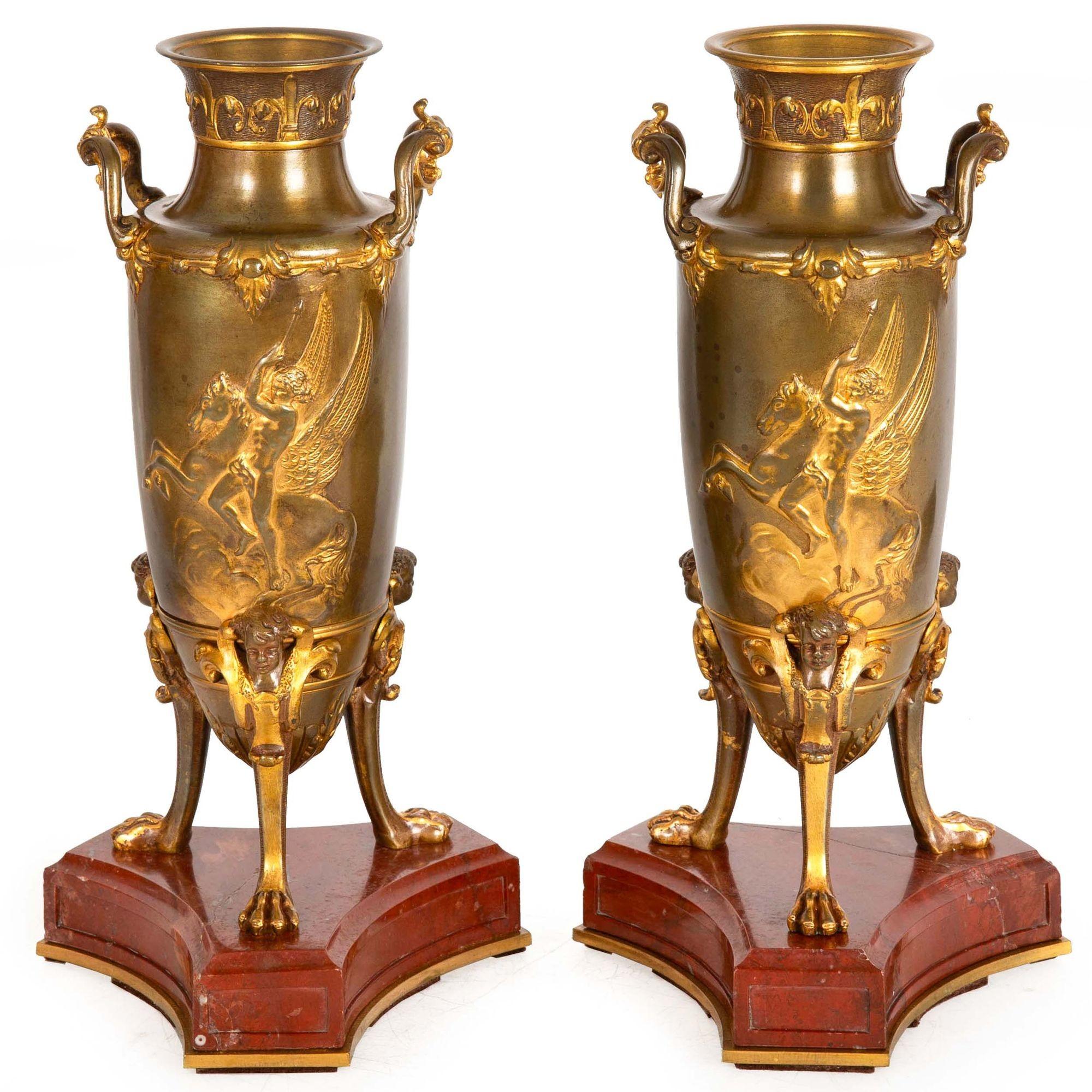 PAIRE DE GARNITURES D'AMPHORES MYTHOLOGIQUES EN BAS-RELIEF REPOSANT SUR DES BASES EN MARBRE ROUGE
Attribué à Ferdinand Levillain et Ferdinand Barbedienne  non marqué  exécuté vers 1880
Référence 604VBP23P

Magnifique paire de garnitures du quatrième