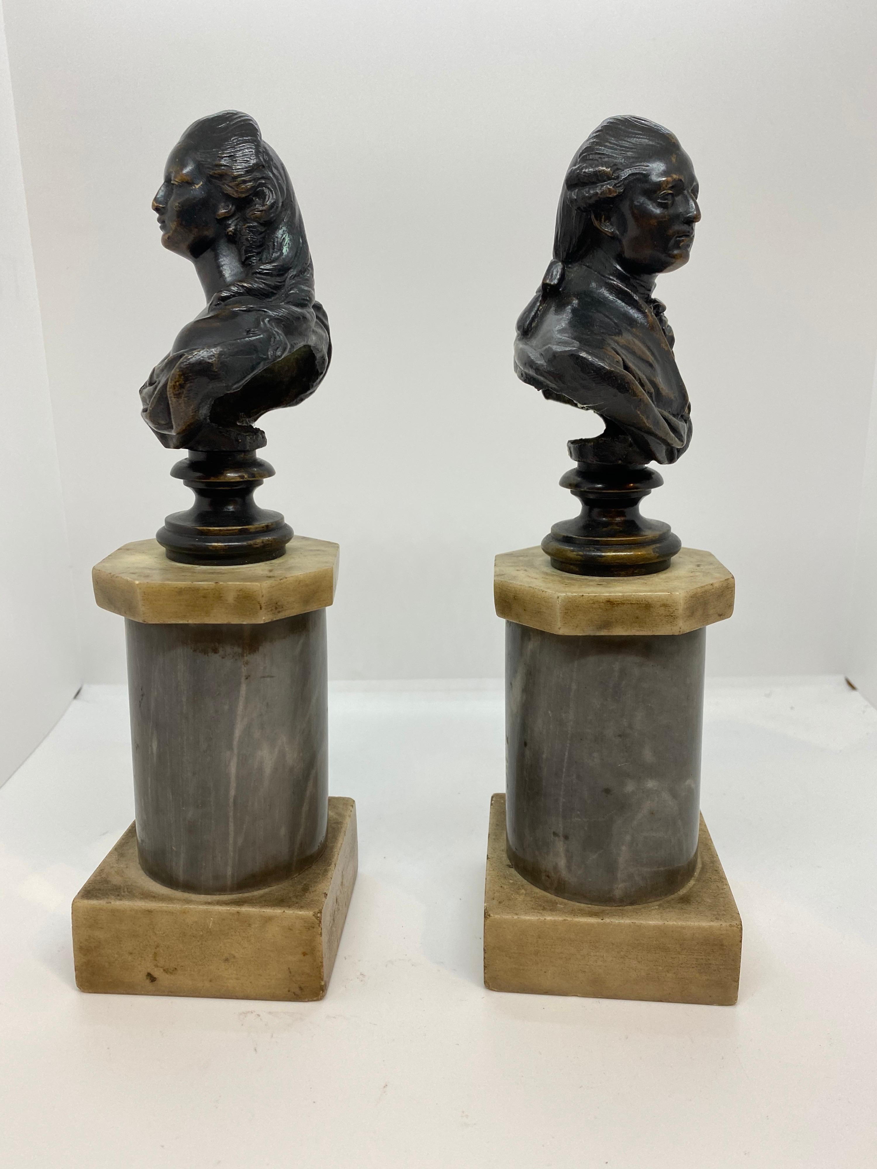 French patinated bronze busts of Louis XVI and Marie Antionette of France. Mounted on a columnar plinth of white and saint Anne gray Mable.