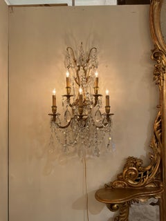 Pair of French bronze dore and crystal sconces