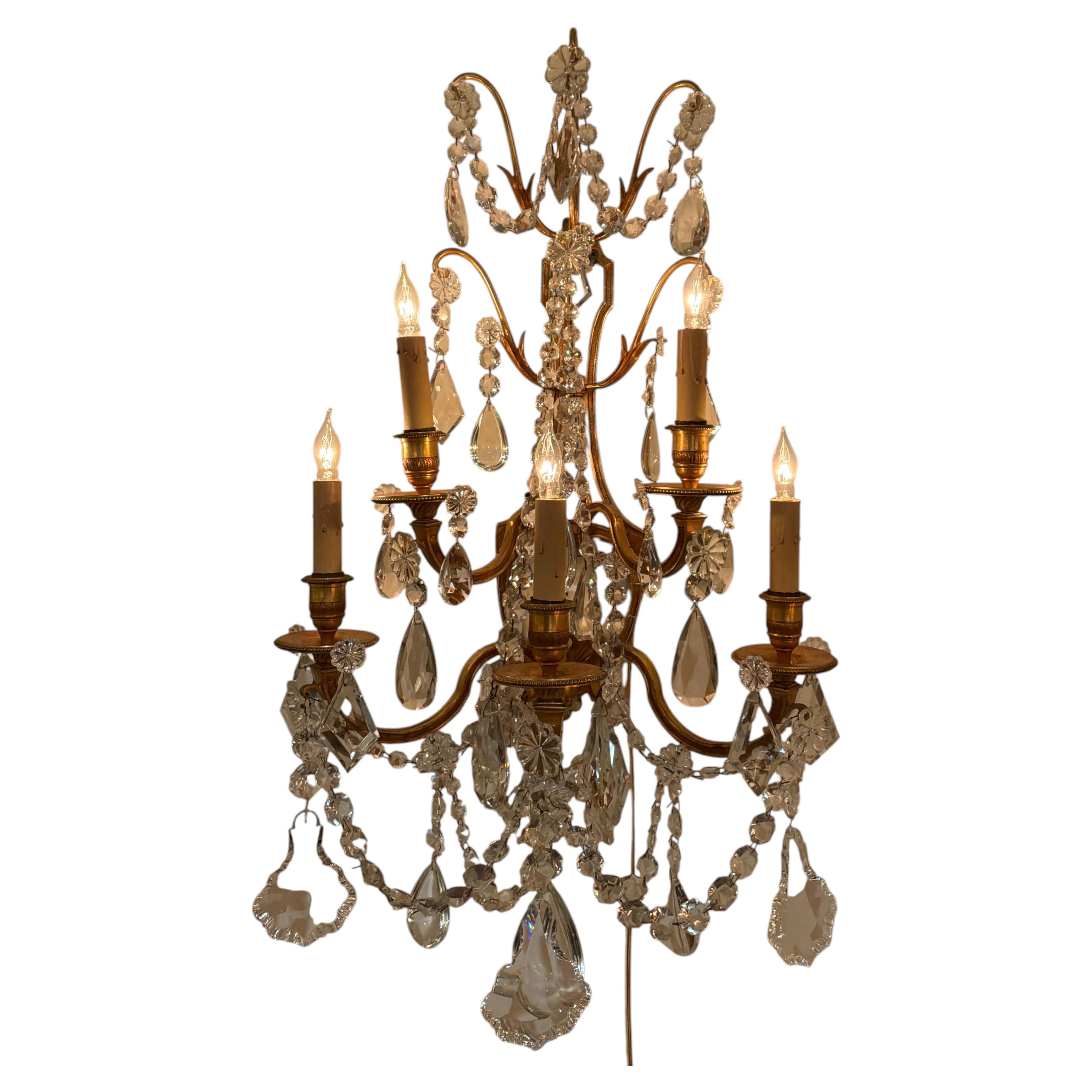 Pair of French bronze dore and crystal sconces