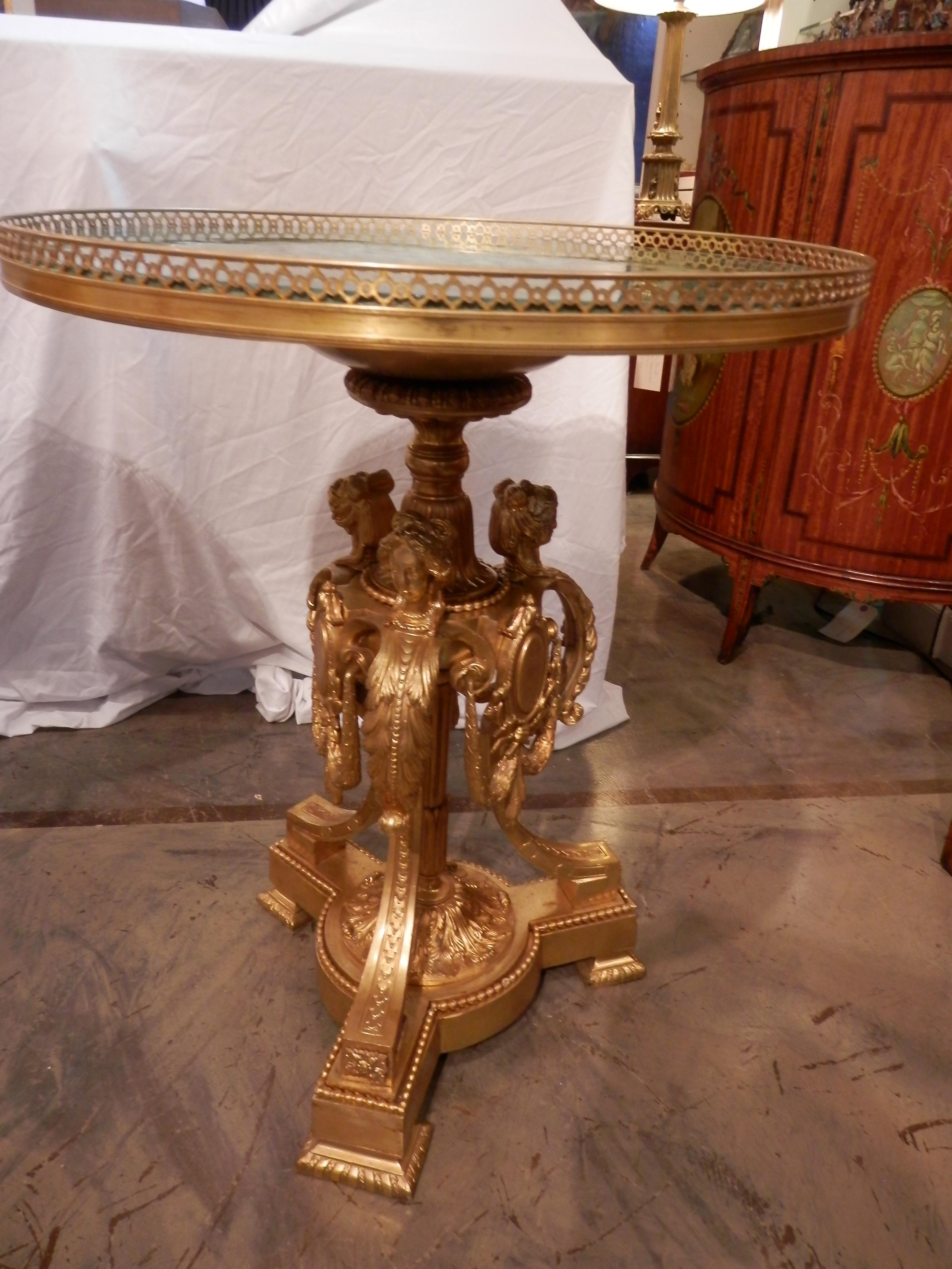 Beautiful pair of French gilt bronze and malachite topped guéridon tables.