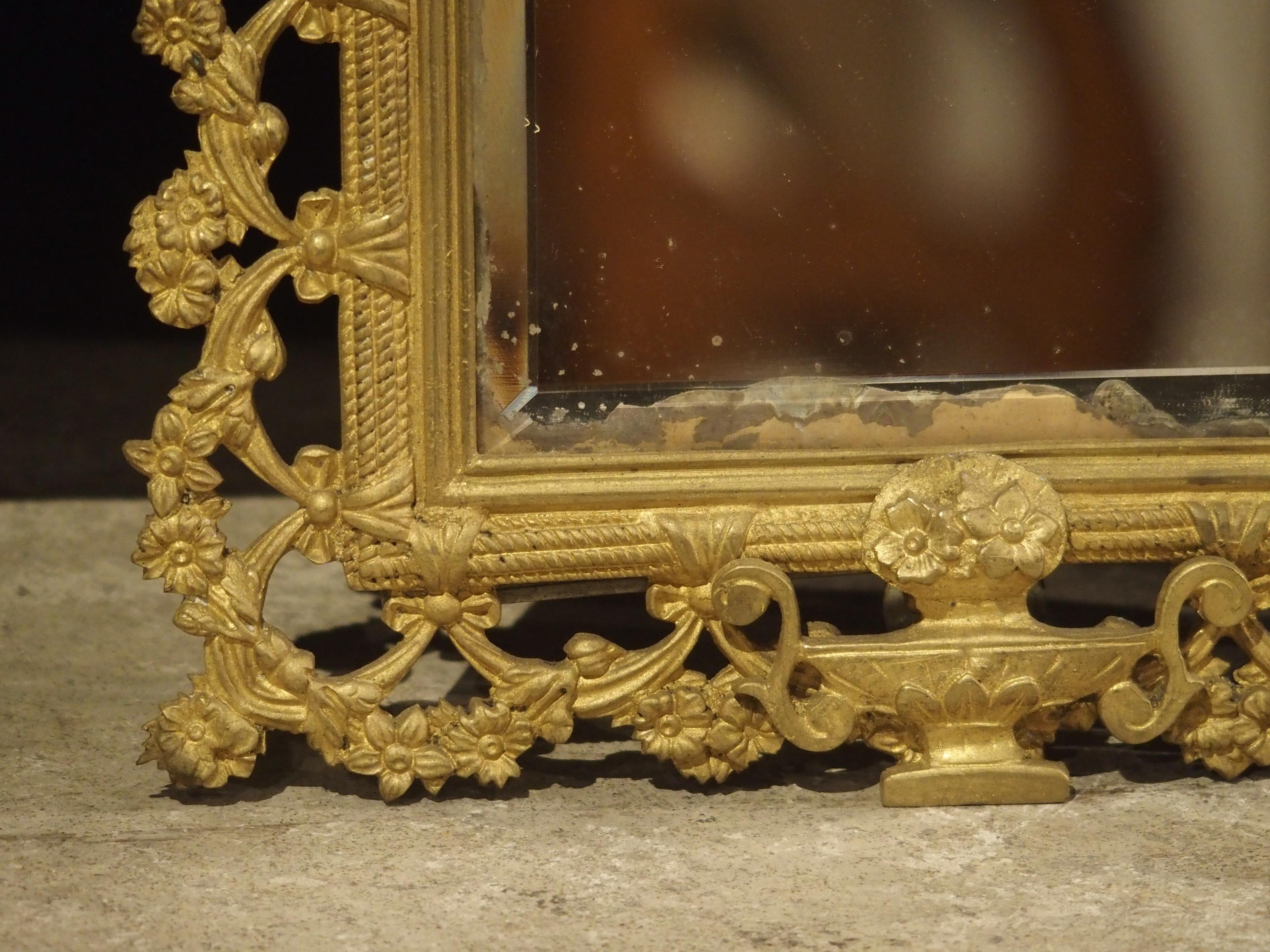 Gilt Pair of French Bronze Dore Mirrors with Mascarons and Floral Motifs, circa 1880 For Sale